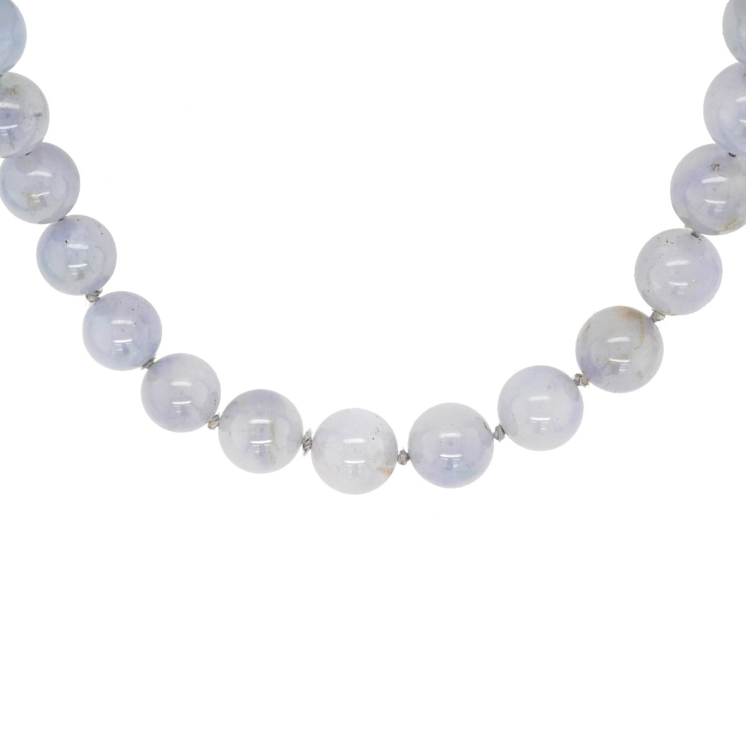Circa 1970s, 14k, by Gump's, San Francisco.    This elegant strand of jade beads is a delicate lavender color. Part of the famous Gump's east meets west narrative, the look is classic San Francisco cool, understated elegance. Excellent