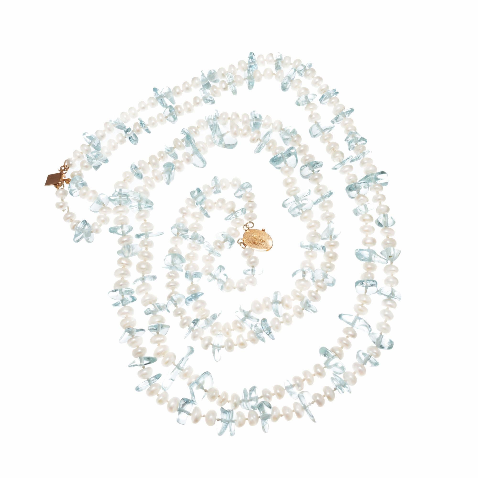 Gumps Aquamarine bead and freshwater pearl two strand necklace at 26 and 27 inches. Can be worn with the catch in the middle as a 53 inch long necklace as well.

118 genuine Aqua beads, 8 x 3 to 12 x 5mm natural tumbled, approx. total weight