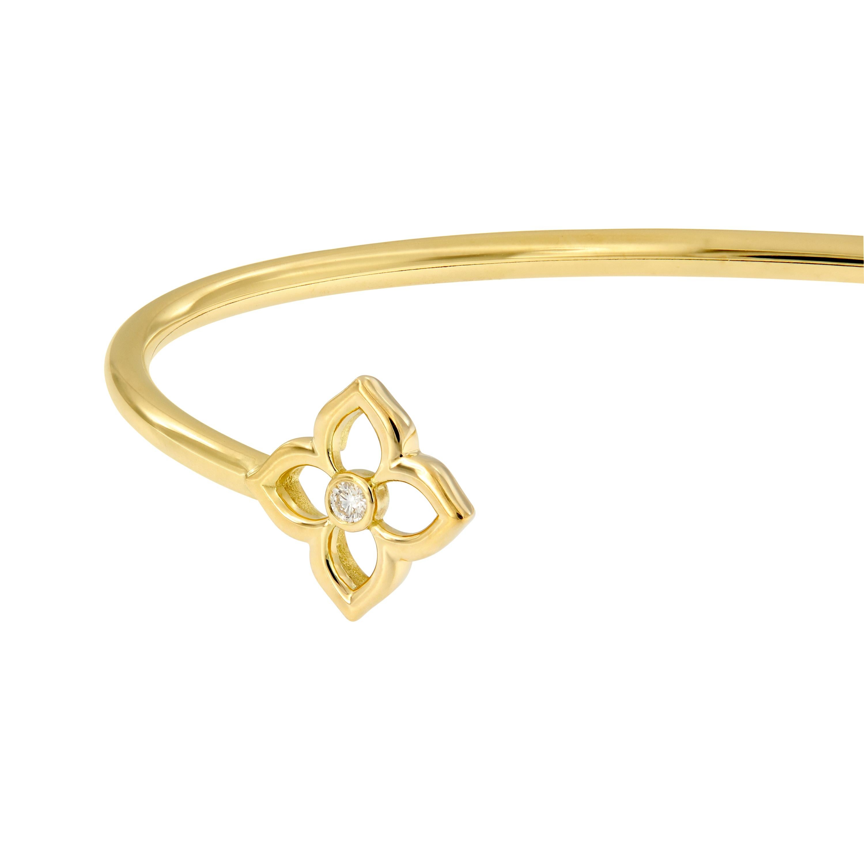 The mini lotus bracelet features two round diamonds bezel-set in high-polished 18k yellow gold. Bracelet is from the G. Boutique Collection by Gumuchian. Weighs x grams. Lotus measures 10mm x 10mm. 

Diamonds 0.10 cttw