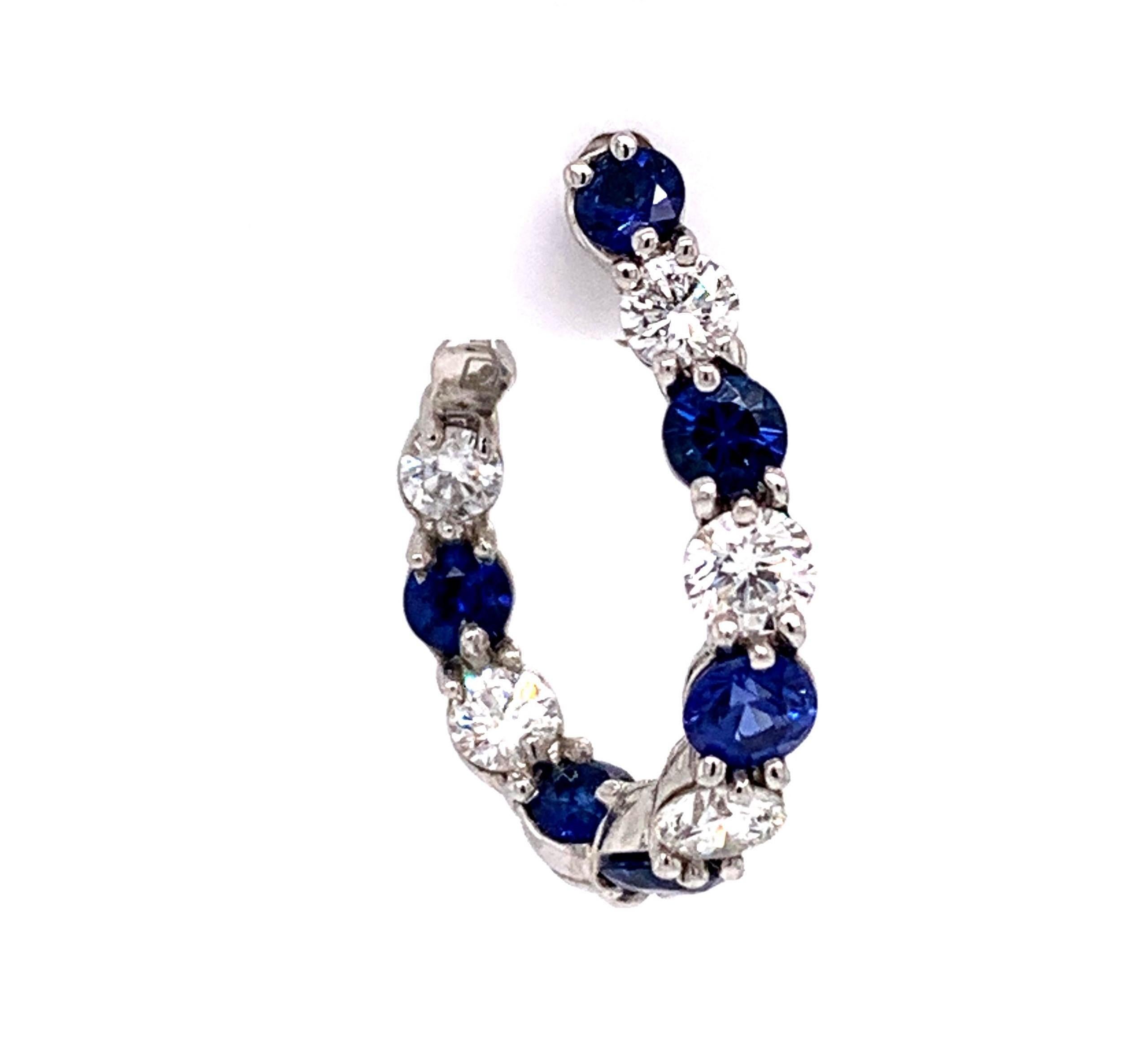 Gumuchian New Moon .90cttw Diamond and Blue Sapphire Platinum Hoop Earrings

Condition:  Excellent Condition, Professionally Cleaned and Polished
Metal:  Platinum
Weight:  6.7g
Gemstone:  12 Round Medium Blue Sapphires 1.25cttw
Diamonds:  10 Round