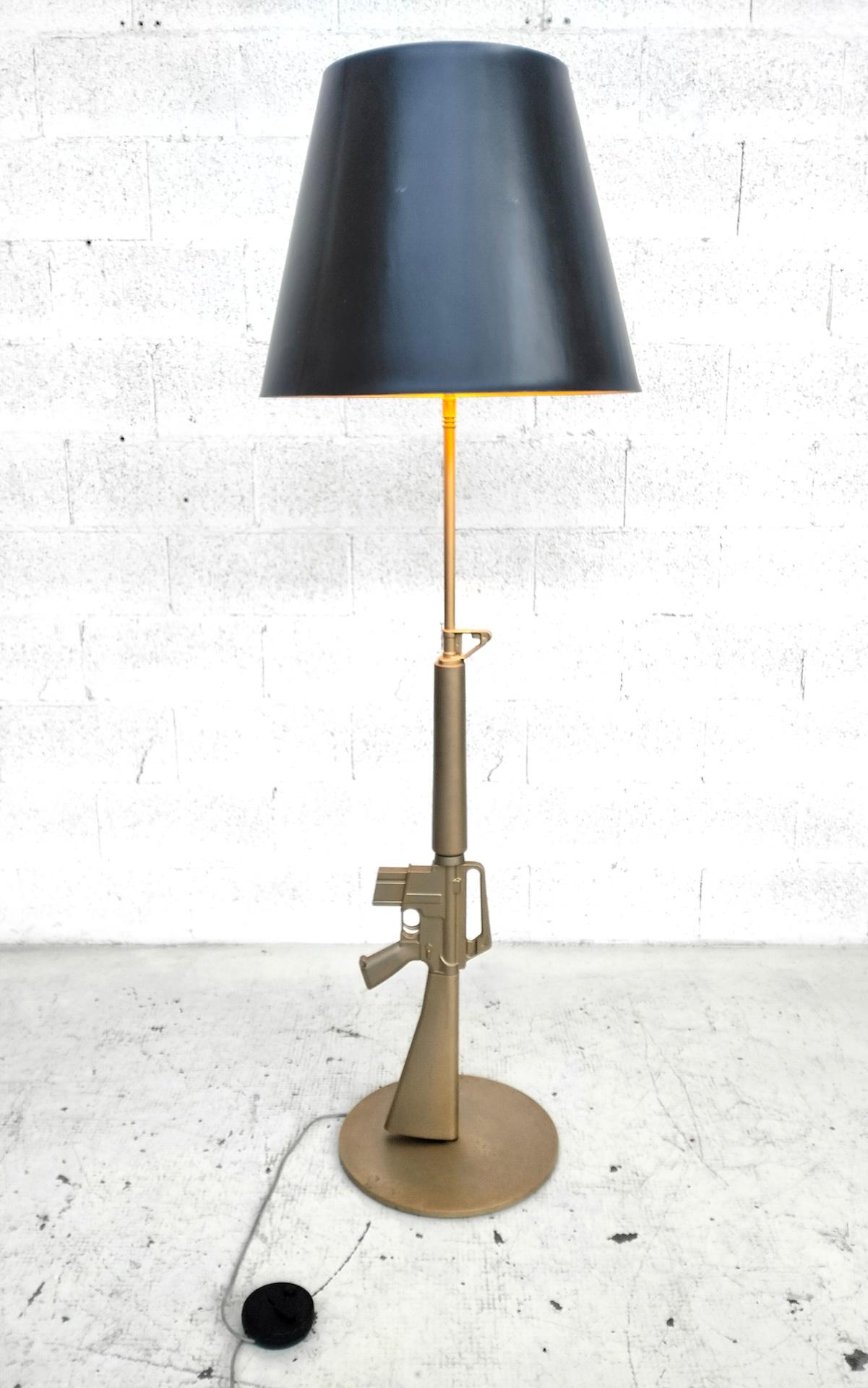 Made of die-cast aluminum overmolded with injection polymer and galvanic finish.

Gun (also known as the Gun collection) is a family of lamps conceived and designed in 2005 by Philippe Starck and produced by the Italian furniture and lighting