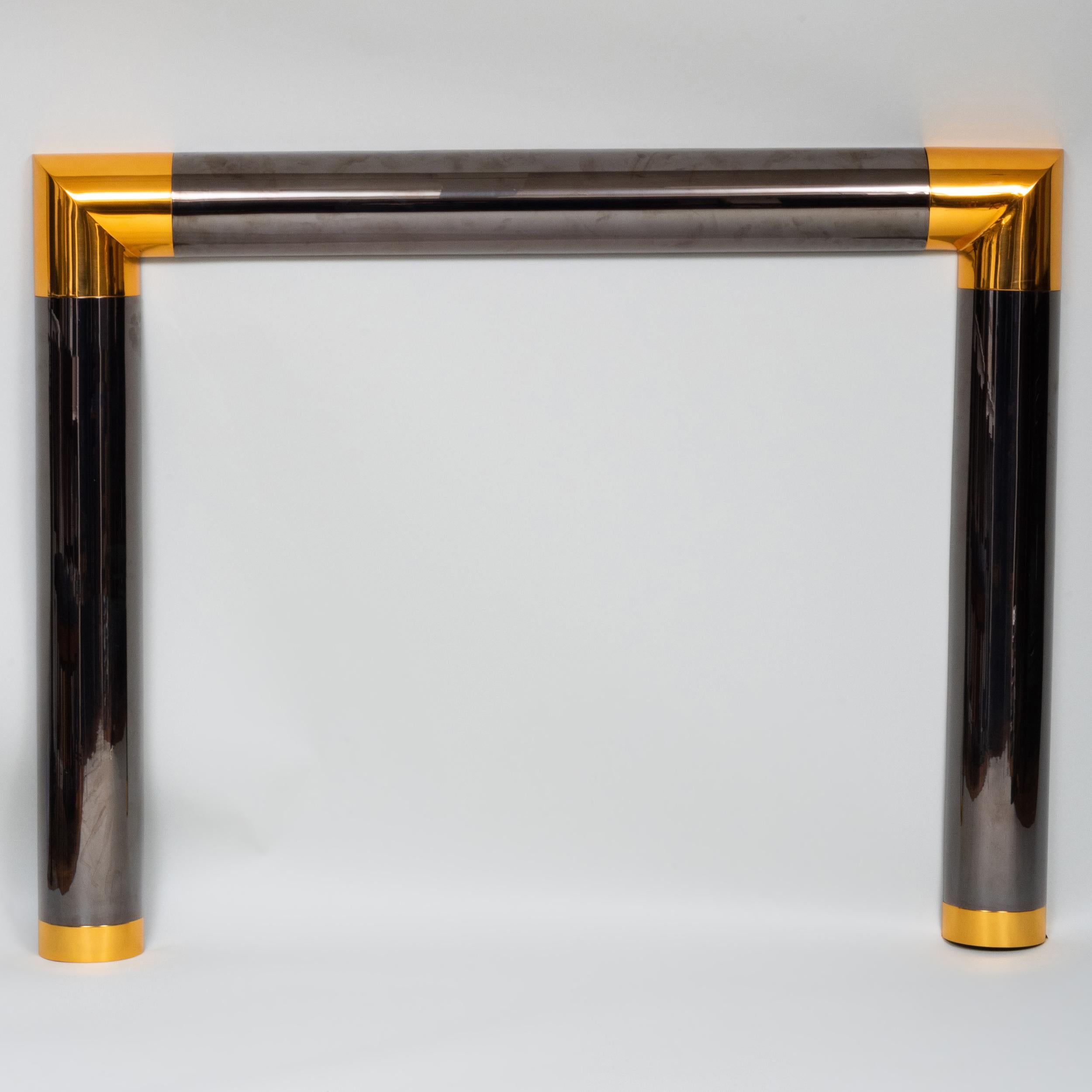 Gun metal and polished brass fire place mantel by Karl Springer.
 Interior dimensions: H:39 L:46.5 in.