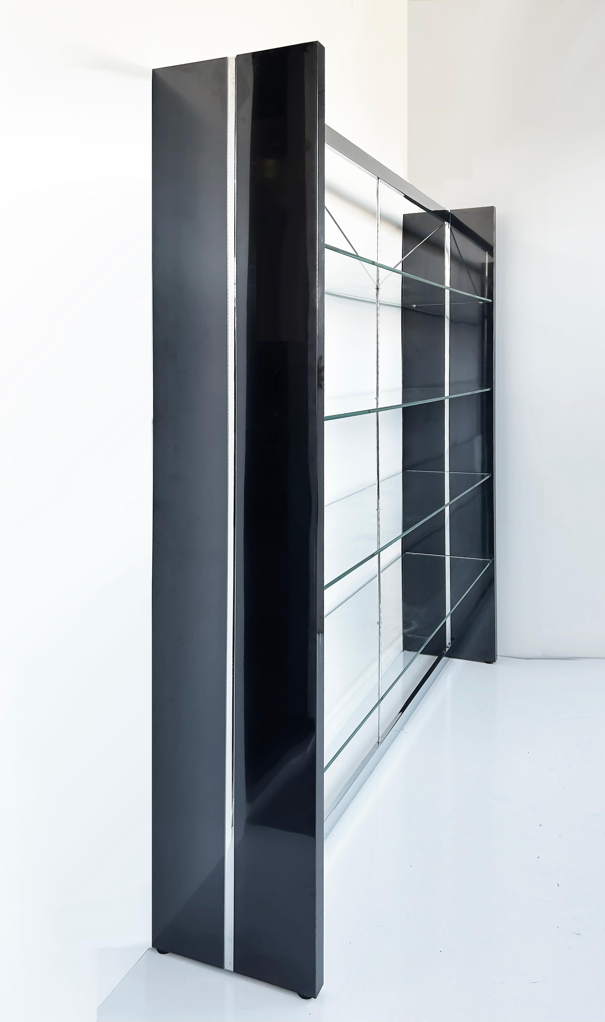 Gun Metal, Stainless, Glass Etagere Shelves or Room Divider

Offered for sale is a fine-quality gun metal, stainless steel, and glass etagere shelving unit that can be used as a room divider. The crisscross supports intersect through the glass shelf