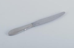 Gundorph Albertus for Georg Jensen. Eight Mitra dinner knives in stainless steel