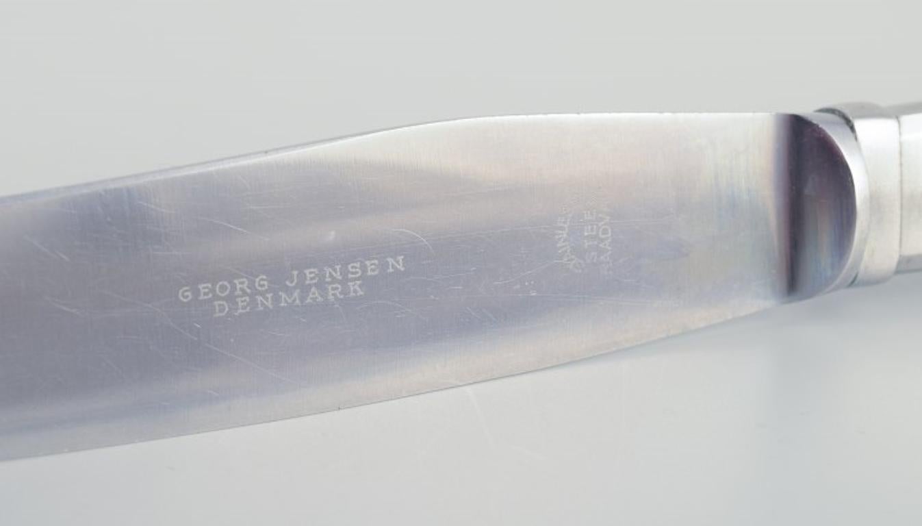 Mid-20th Century Gundorph Albertus for Georg Jensen. Four Mitra dinner knives in stainless steel