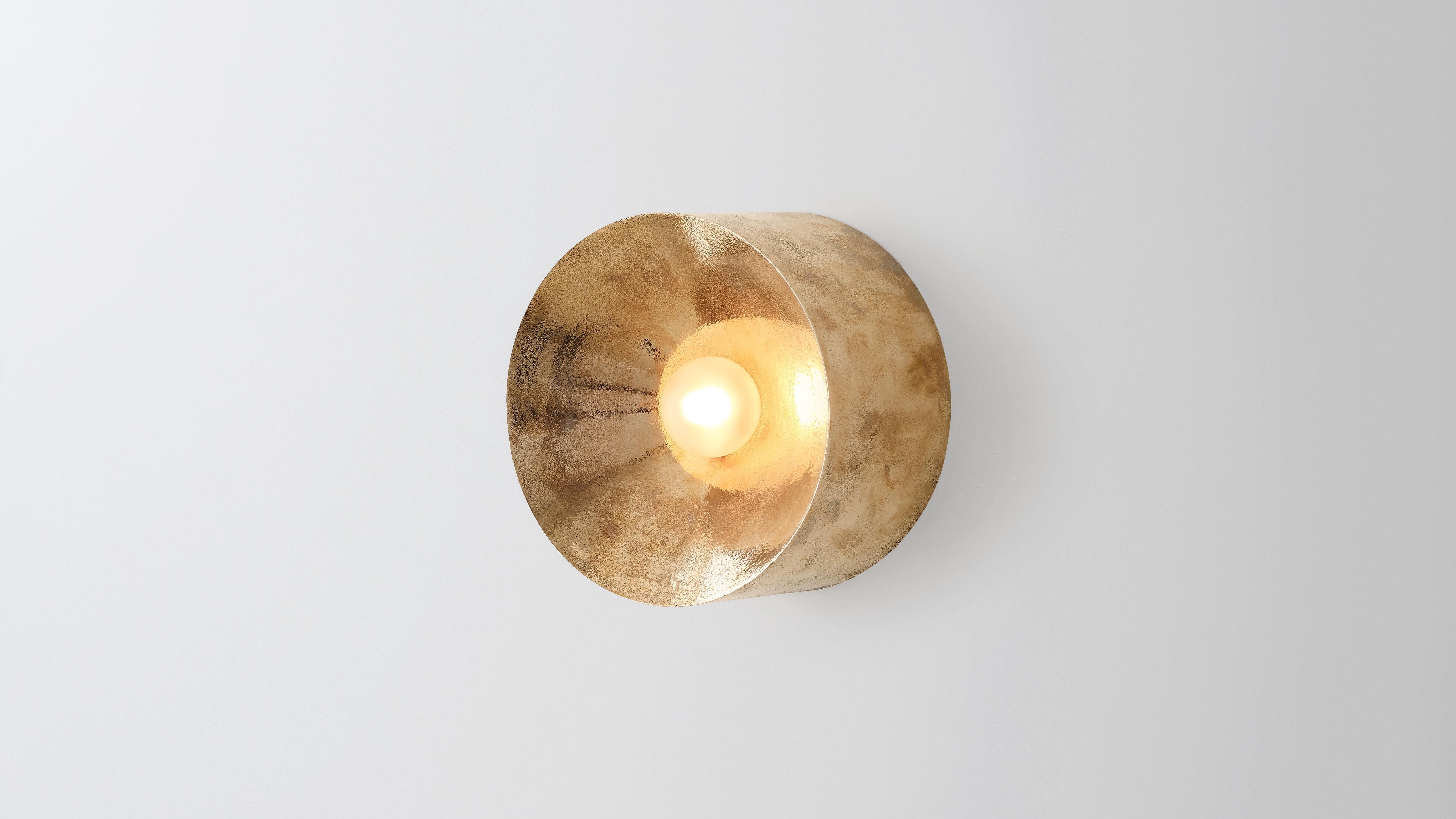 Anton in dunmetal by Volker Haug 
Anton series
Dimensions: W 18 H 18 D 10.3 cm
Materials: Cast gunmetal
Finish: Polished
Lamp: G9 LED (240V / 120V US). 12V option available
Glass Bulb: 4.5 cm ø, Frosted
Weight : 4kg

Form follows force. The Anton