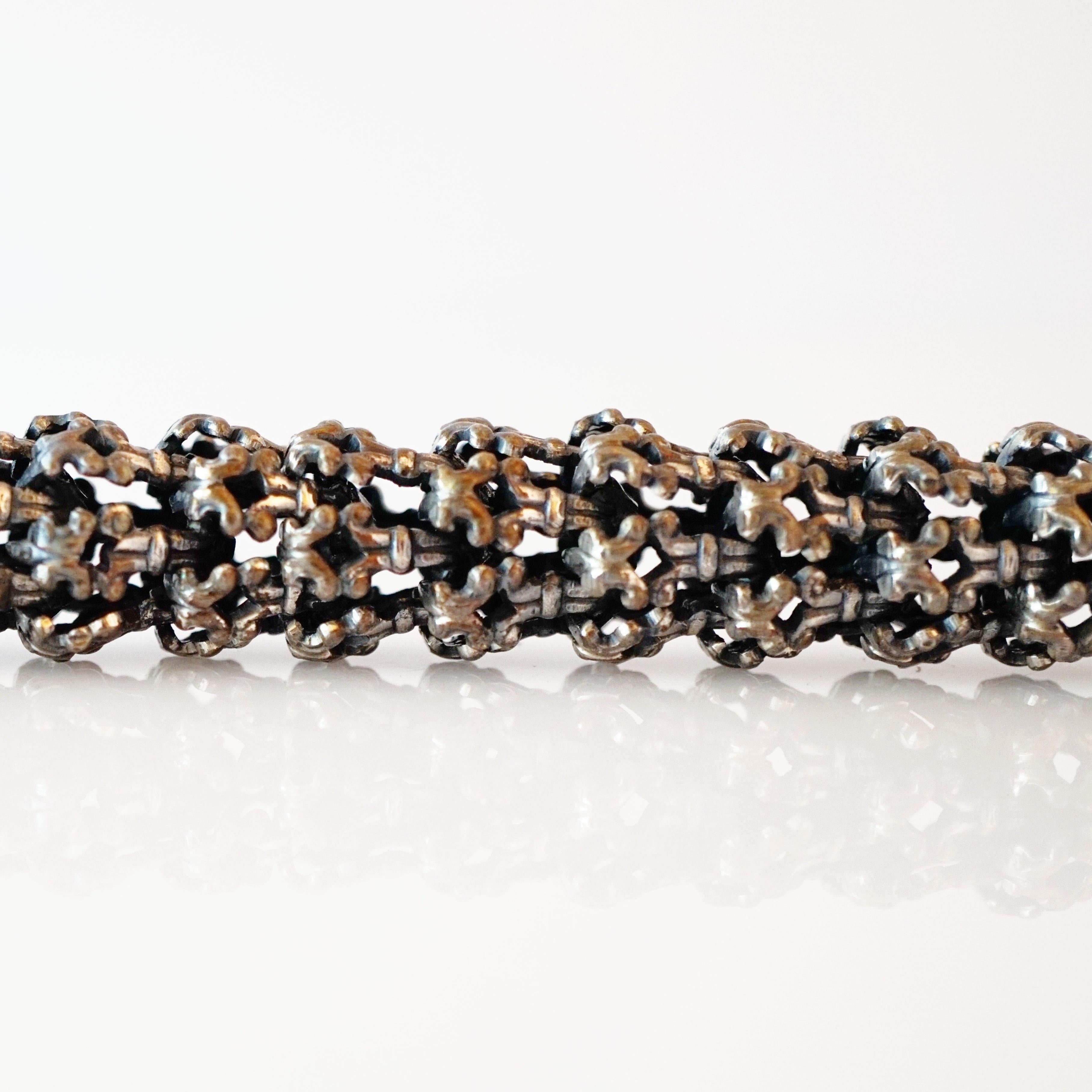 - Vintage item

- Collectible costume jewelry piece from the mid-century

- Extremely rare, hard to find piece

- Articulating, oxidized silver caged lattice links

- 17