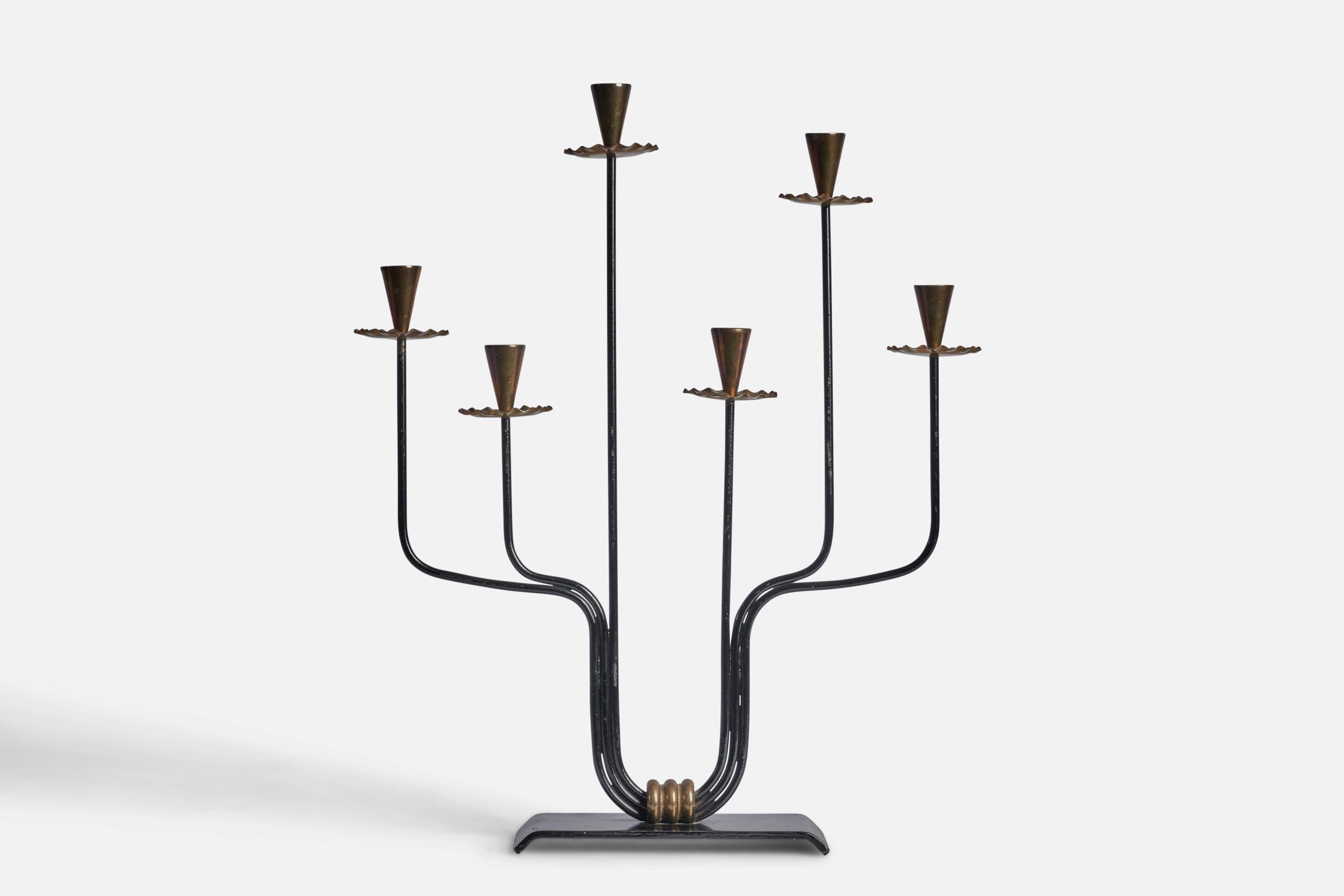A brass and black-lacquered metal candelabra designed by Gunnar Ander and produced by Ystad-Metall, Sweden, c. 1940s.

fits 0.5” diameter candle
