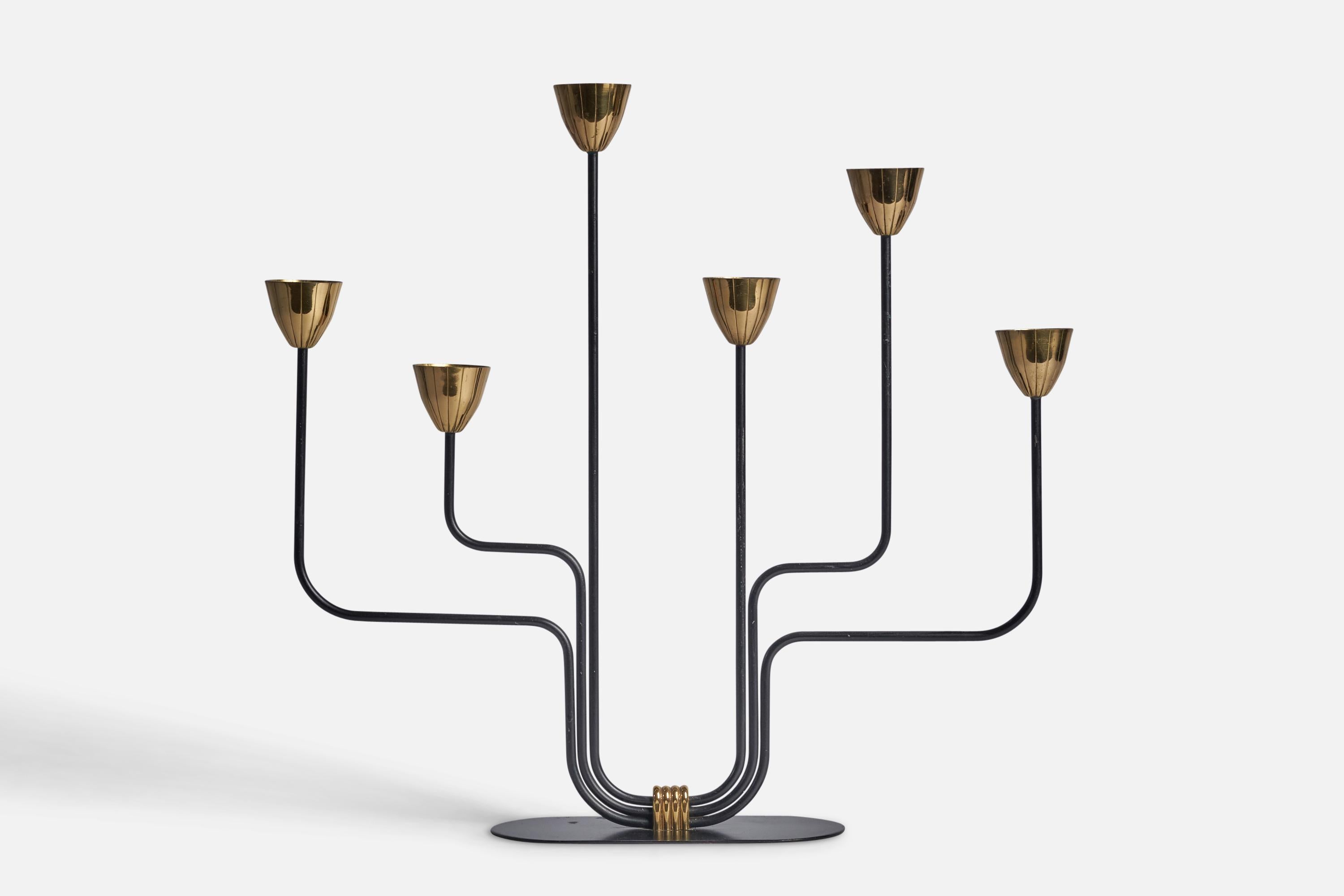 A brass and black-painted metal candelabra designed by Gunnar Ander and produced by Ystad-Metall, Sweden, c. 1950s.

Fits 0.8” diameter candles