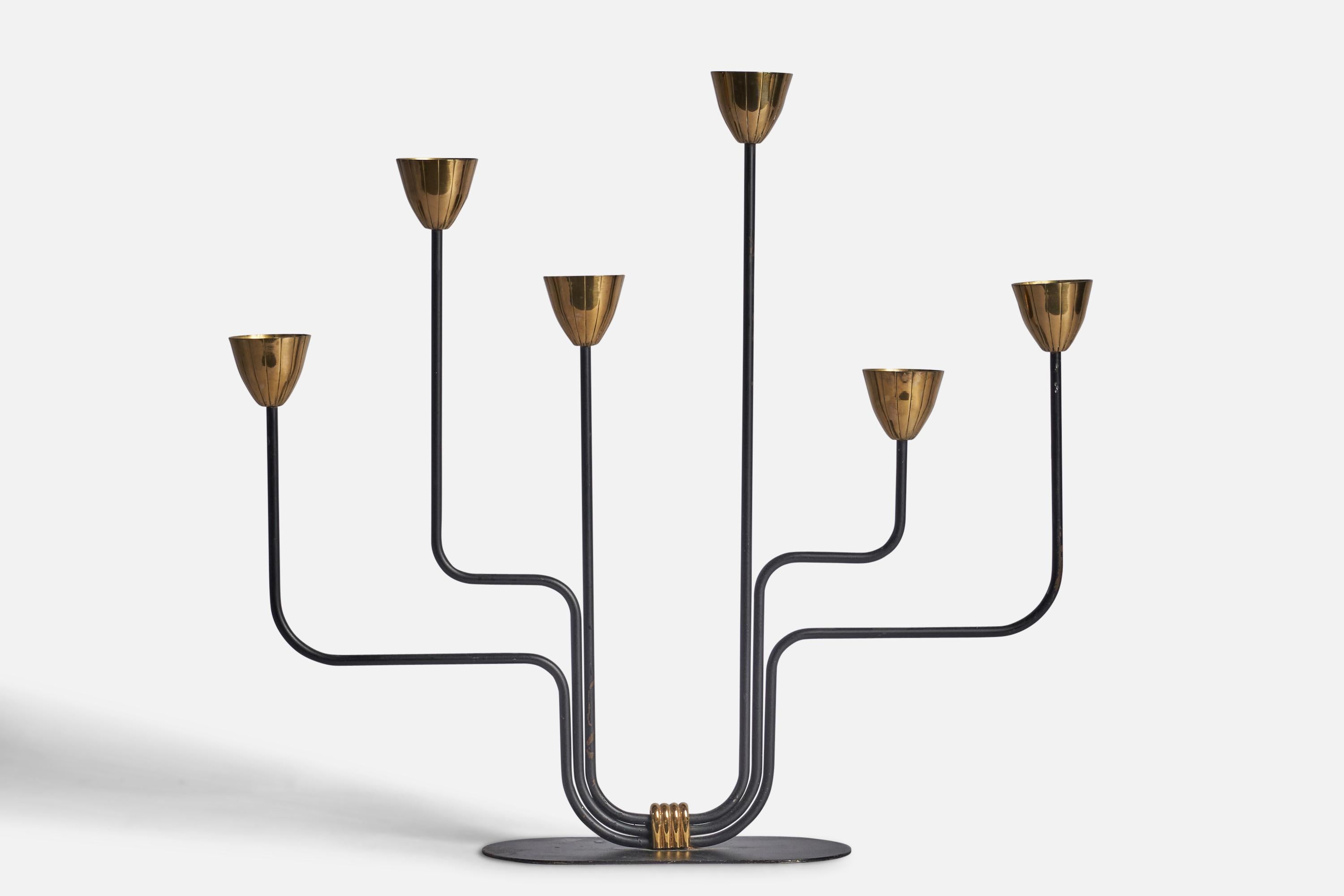 A brass and black-painted metal candelabra designed by Gunnar Ander and produced by Ystad-Metall, Sweden, 1950s.

Fits 0.80” diameter candles