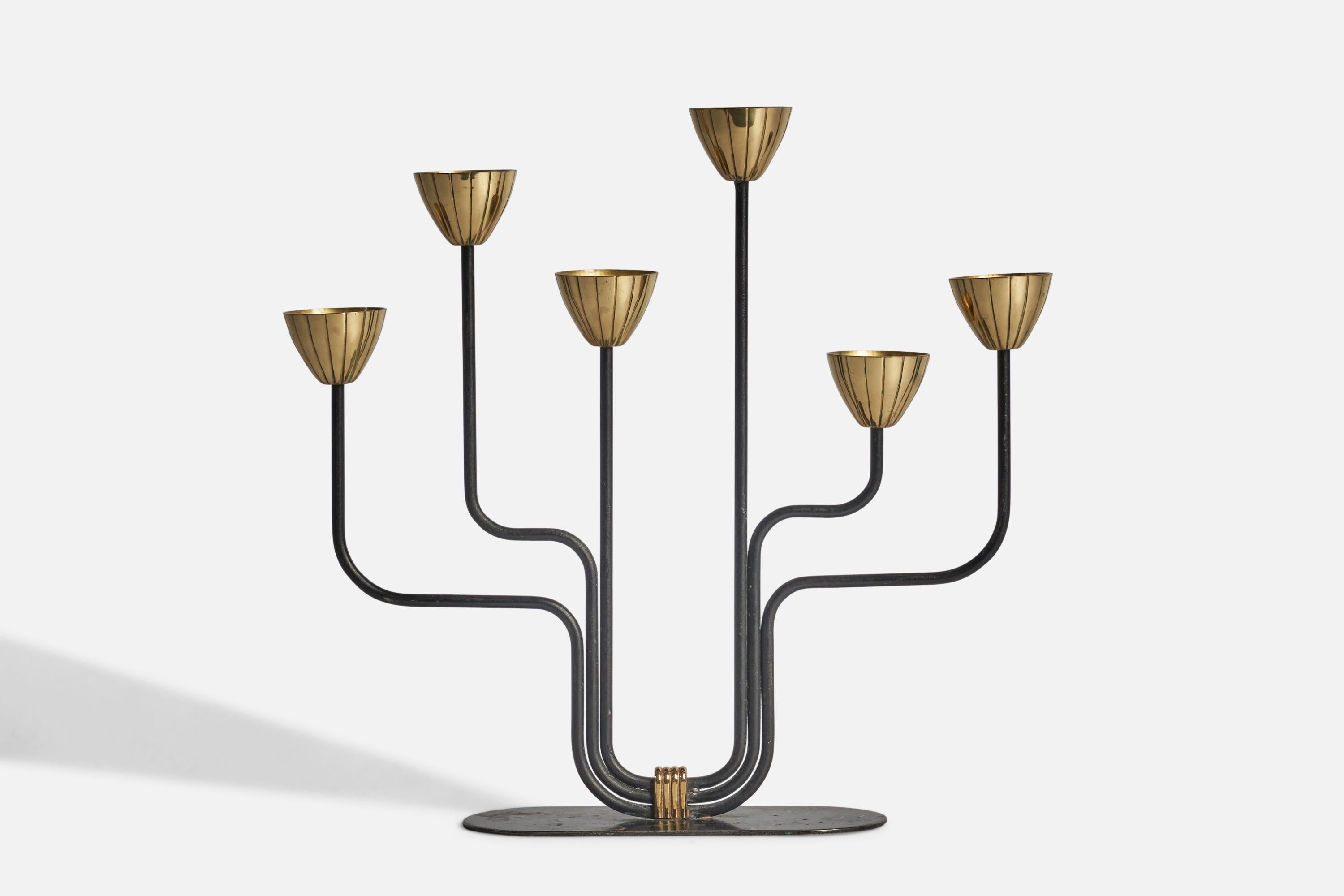 A brass and black-lacquered metal candelabra designed by Gunnar Ander and produced by Ystad-Metall, Sweden, 1950s.

Fits 0.5” diameter candles