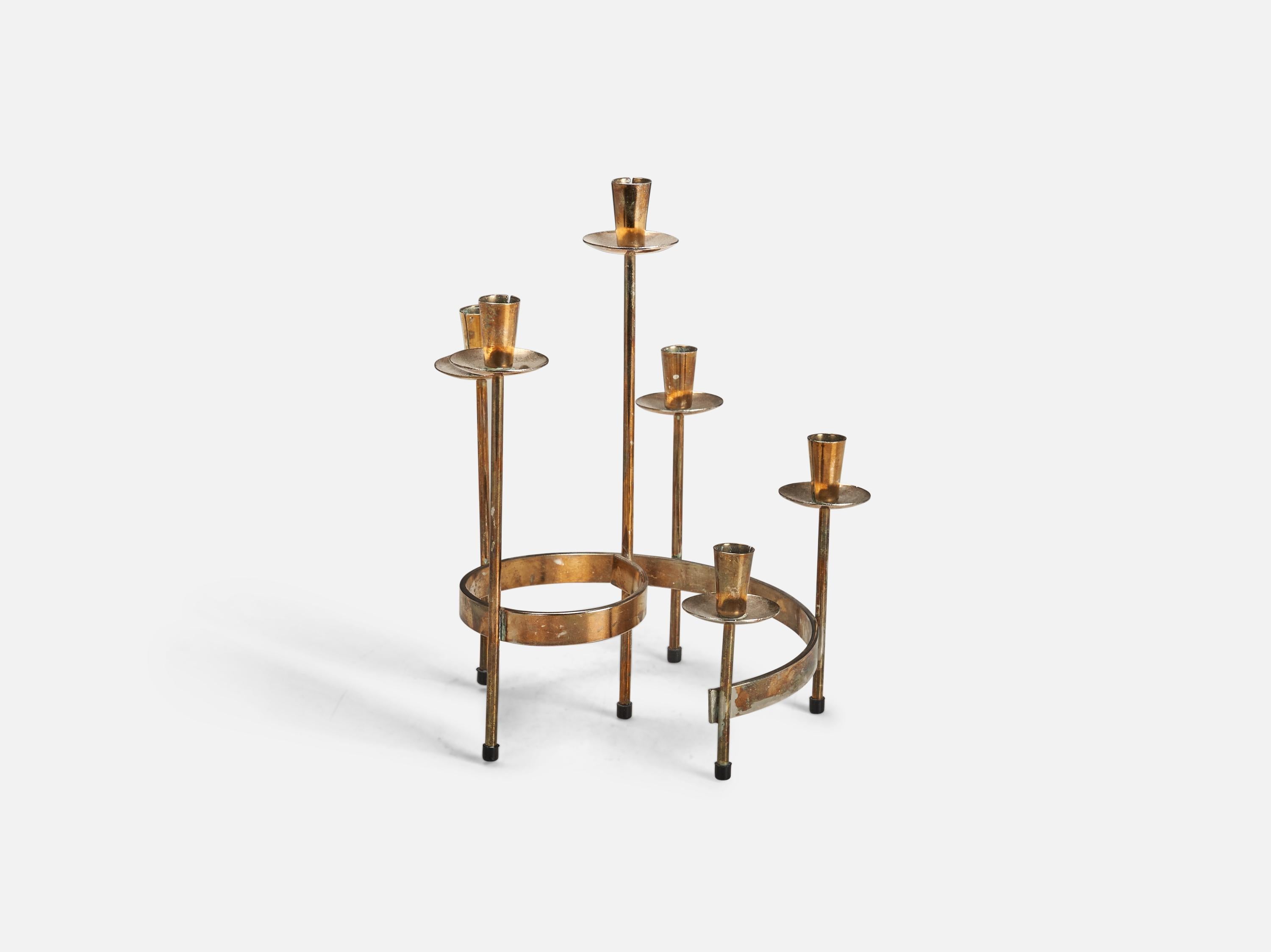 A brass candelabra designed and produced in Sweden, 1950s.