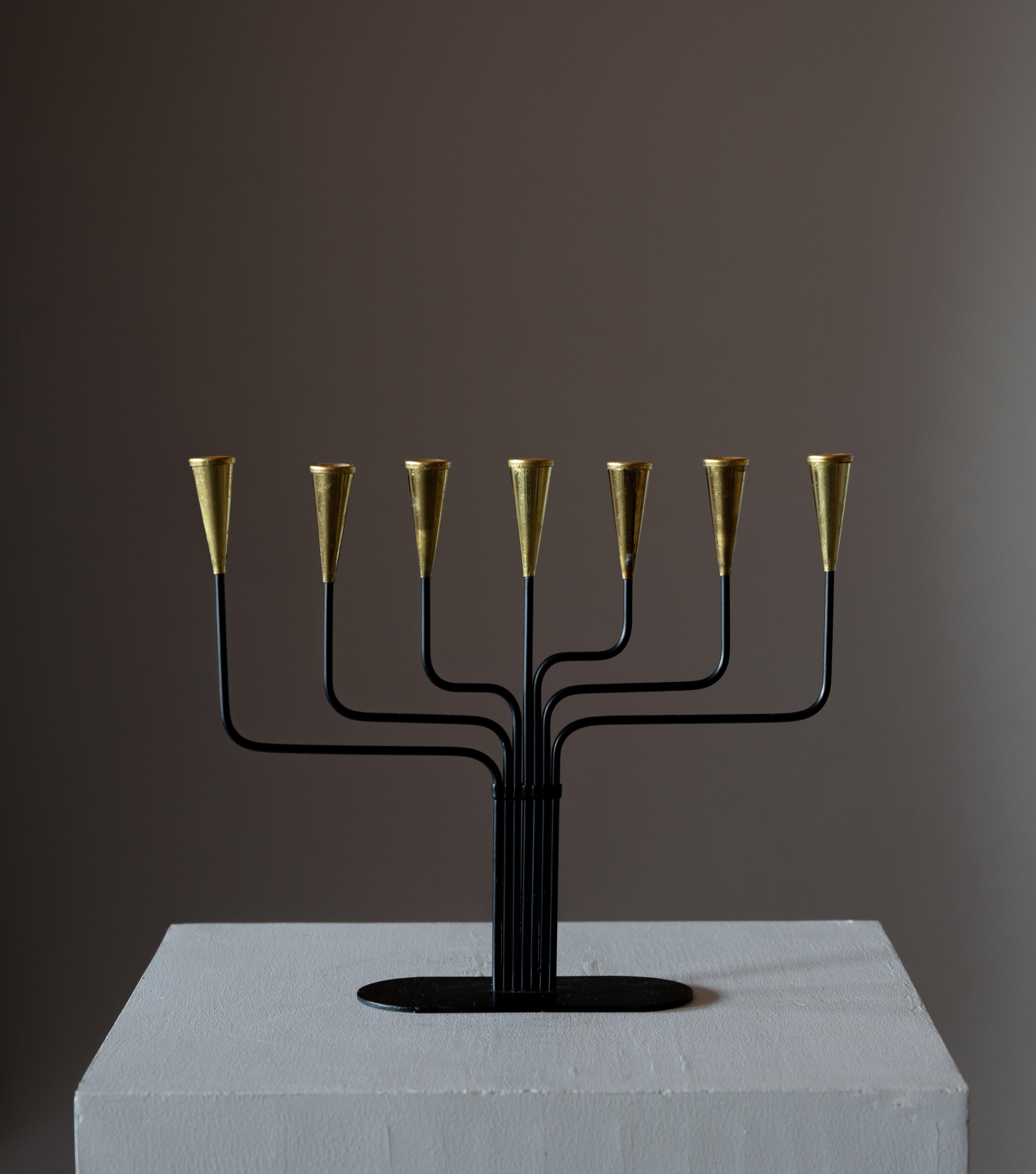 A candelabra, designed by Gunnar Ander for Ystad Metall, Sweden, 1950s. In brass. Stamped. For small candles.

Other designers of the period include Piet Hein, Paavo Tynell, Josef Frank, and Jean Royere.

