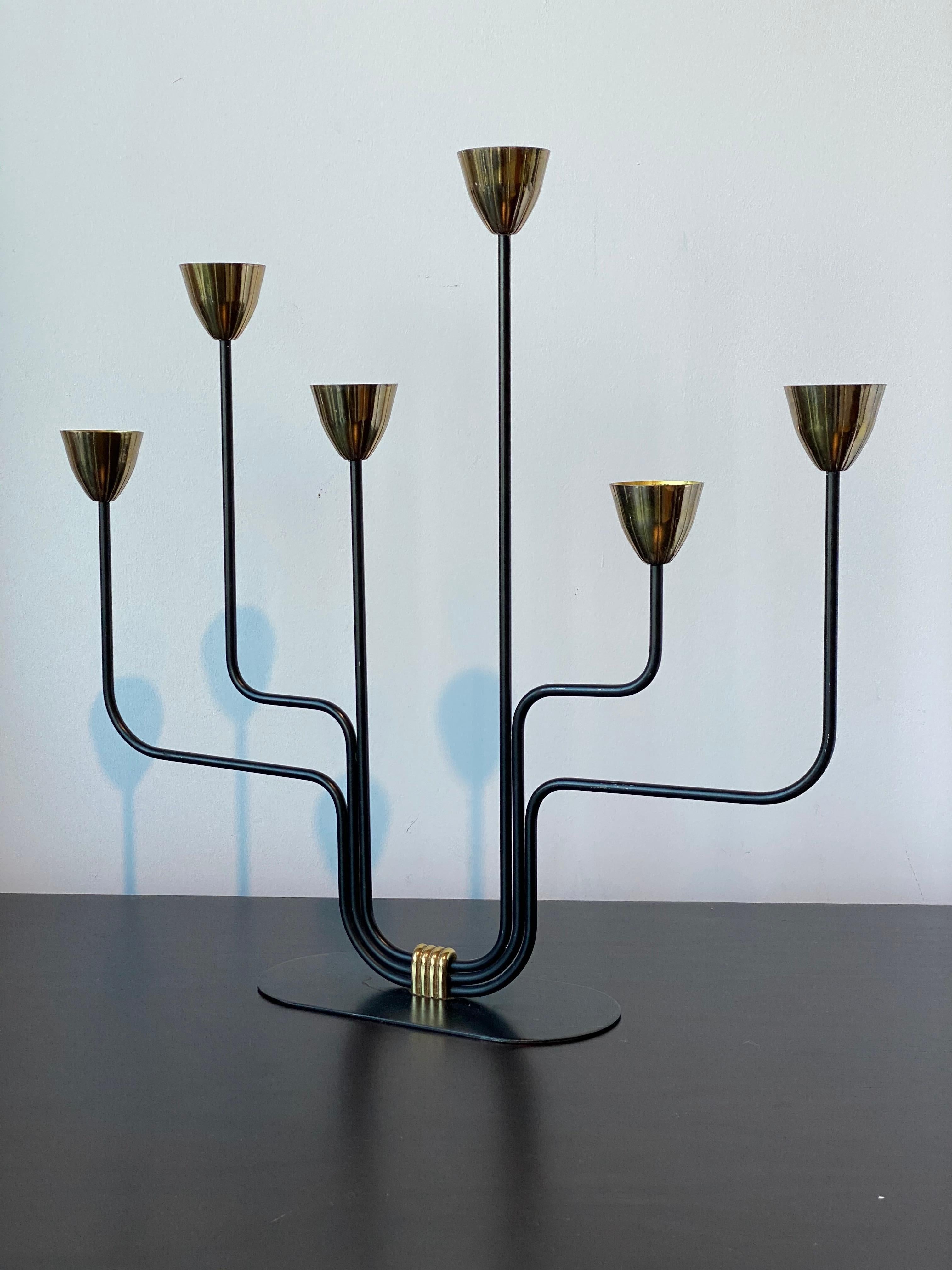 A pair of organic candelabras / candleholders, designed by Gunnar Ander for Ystad Metall, Sweden, 1950s. In brass and lacquered steel. Stamped.

Other designers of the period include Piet Hein, Paavo Tynell, Josef Frank, and Jean Royere.

 