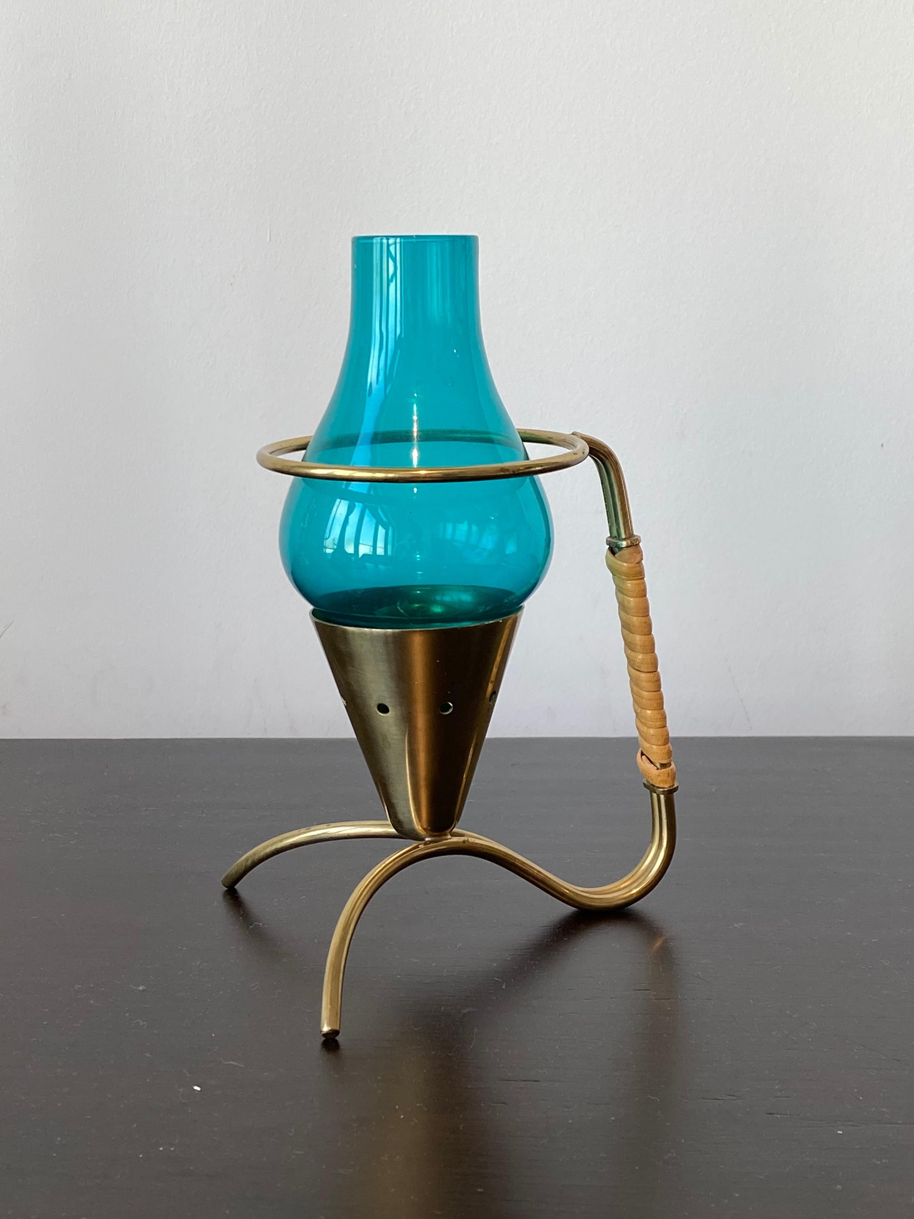 An organic candleholder / candle light, designed by Gunnar Ander for Ystad Metall, Sweden, 1960s. In brass, cane. Stamped.

Other designers of the period include Piet Hein, Paavo Tynell, Josef Frank, and Jean Royere.

        
