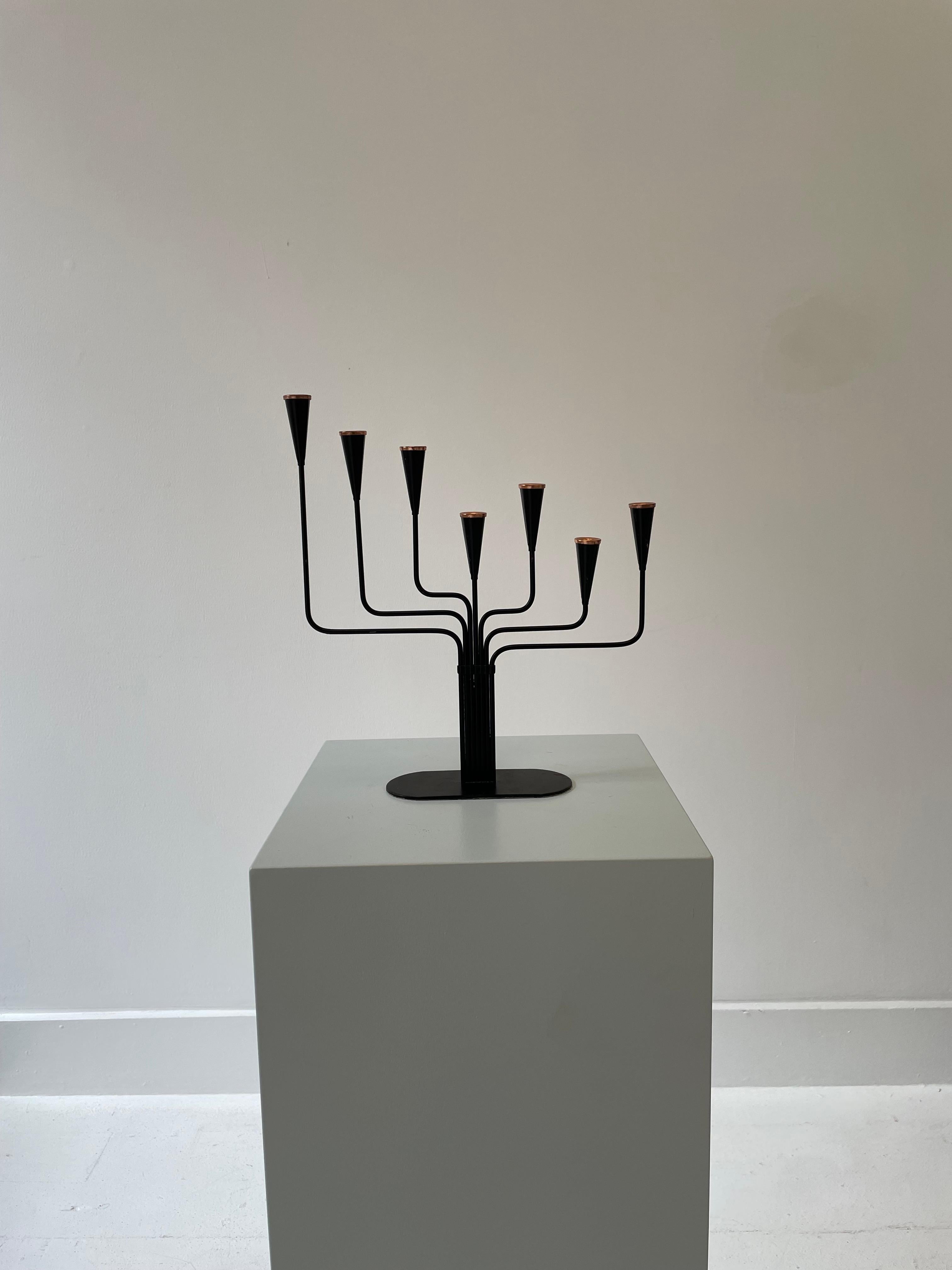 Height: 28cm
Width: 28cm
Depth: 6cm

Designer: Gunnar Ander 
Date: 1950s
Materials: Metal, copper

Description: The Gunnar Ander Candleholder A is a sleek and minimalist piece designed by Swedish designer Gunnar Ander. Crafted in the mid-20th