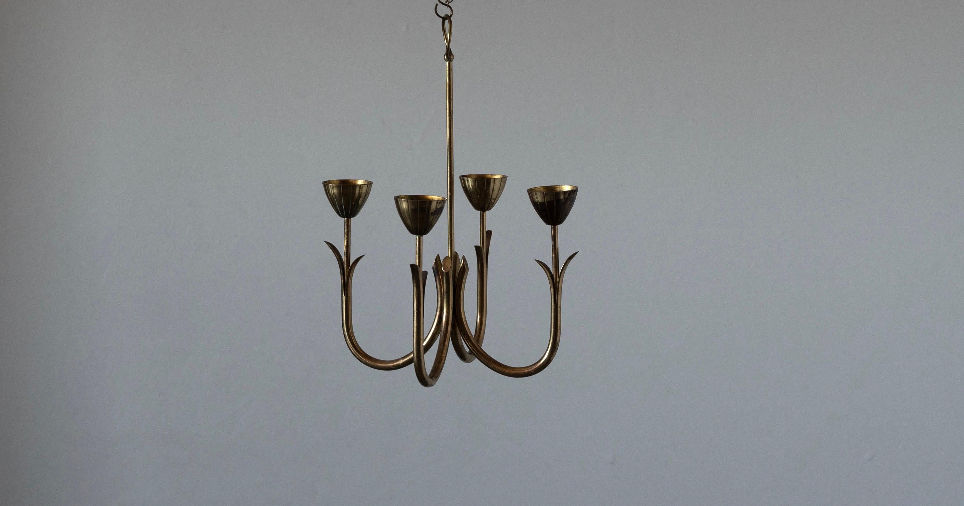 A candelabra, designed by Gunnar Ander for Ystad Metall, Sweden, 1950s. In brass. Stamped. Can either be hung from ceiling, or placed on table.

Other designers of the period include Piet Hein, Paavo Tynell, Josef Frank, and Jean Royere.

