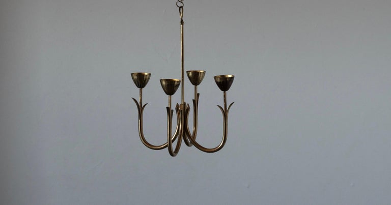 A candelabra, designed by Gunnar Ander for Ystad Metall, Sweden, 1950s. In brass. Stamped. Can either be hung from ceiling, or placed on table.

Other designers of the period include Piet Hein, Paavo Tynell, Josef Frank, and Jean Royere.

