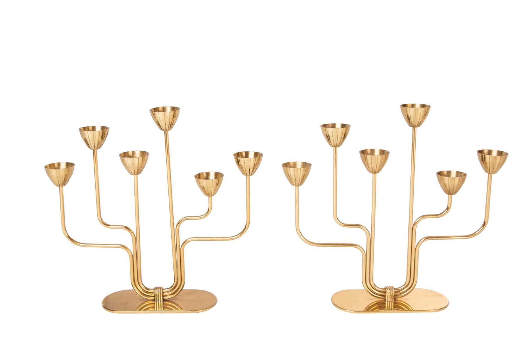 Pair of solid brass candelabras by Gunnar Ander for Ystad Metall.