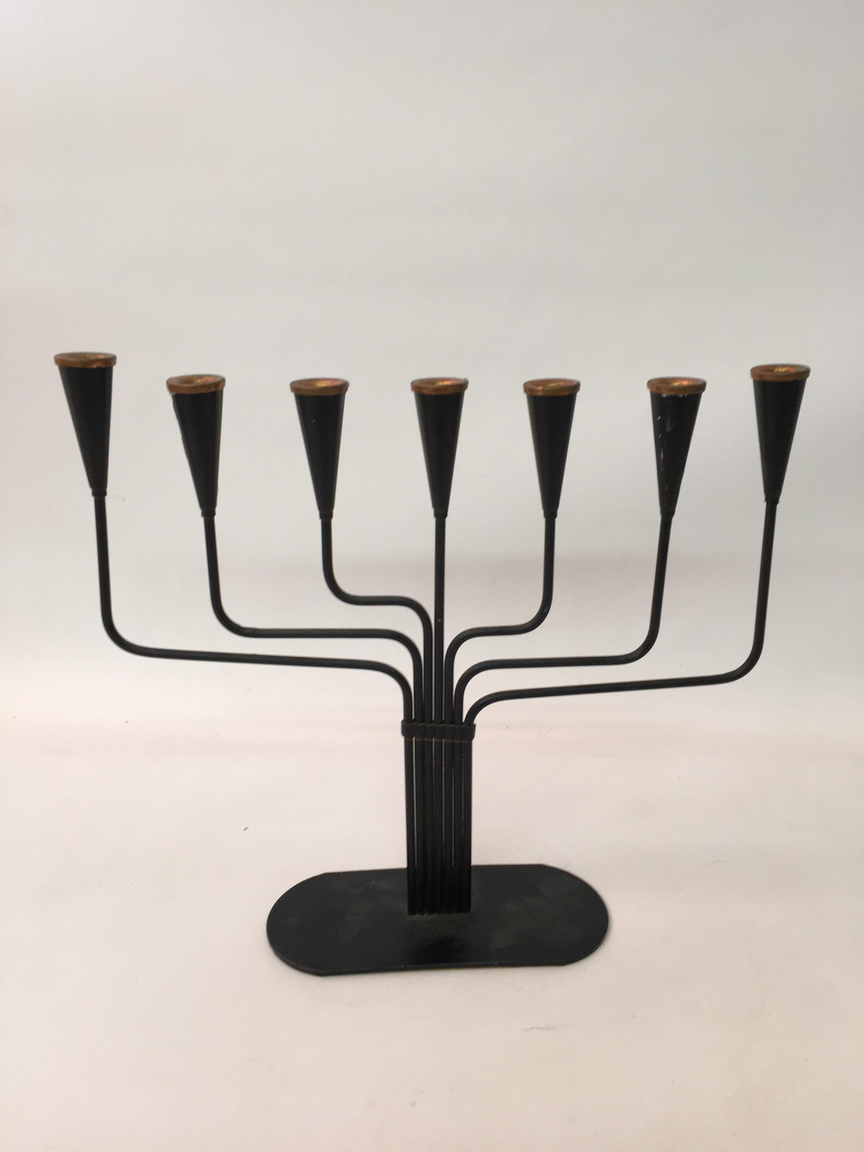 Seven taper candelabrum designed by Gunnar Ander for Ystad Metal, Sweden. Copper accents with a matte black lacquered base and felted bottom. Reminiscent of Piet Hein's variation of the Ursa Major candleholder, circa 1960.