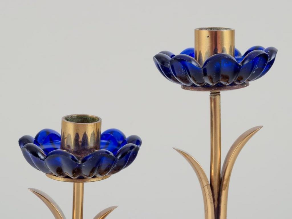 Mid-20th Century Gunnar Ander for Ystad Metall/ Candlestick holder in brass and blue art glass. For Sale
