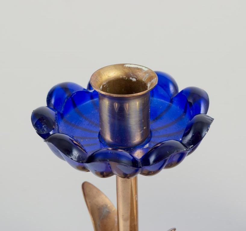 Brass Gunnar Ander for Ystad Metall.  Candlestick holder in brass and blue art glass For Sale