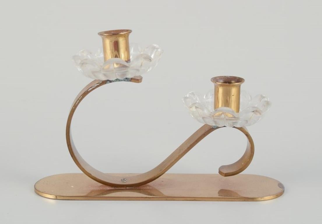 Mid-20th Century Gunnar Ander for Ystad Metall, Sweden. Candlestick holder in brass and glass. For Sale