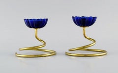 Gunnar Ander for Ystad Metall, Two Candlesticks in Brass and Blue Art Glass