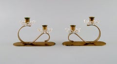 Gunnar Ander for Ystad Metall, Two Candlesticks in Brass and Clear Art Glass