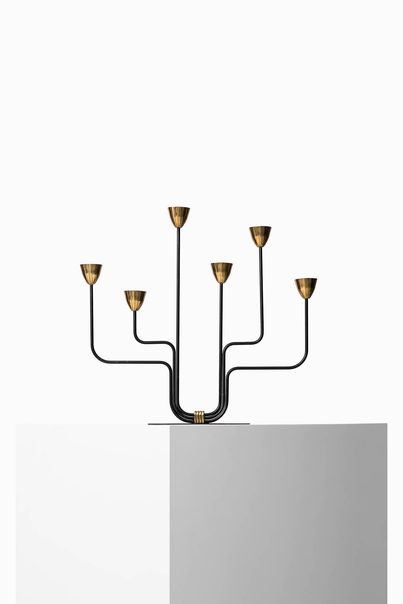 Large candlestick designed by Gunnar Ander. Produced by Ystad Metall in Sweden.