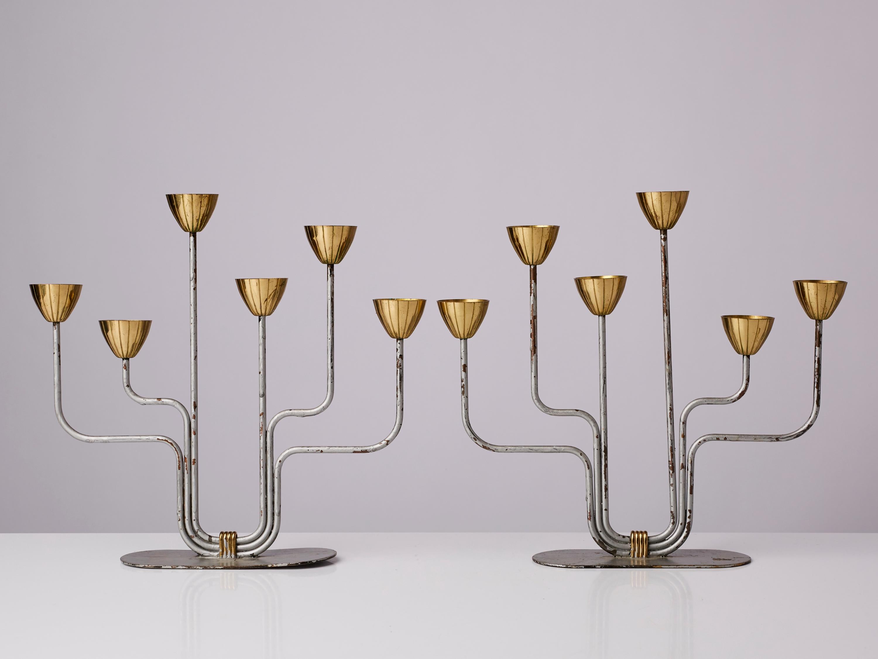 A pair of organic candelabras / candleholders, designed by Gunnar Ander for Ystad Metall, Sweden, 1950s. In brass and lacquered steel. Stamped.

Other designers of the period include Piet Hein, Paavo Tynell, Josef Frank, and Jean Royere.

  