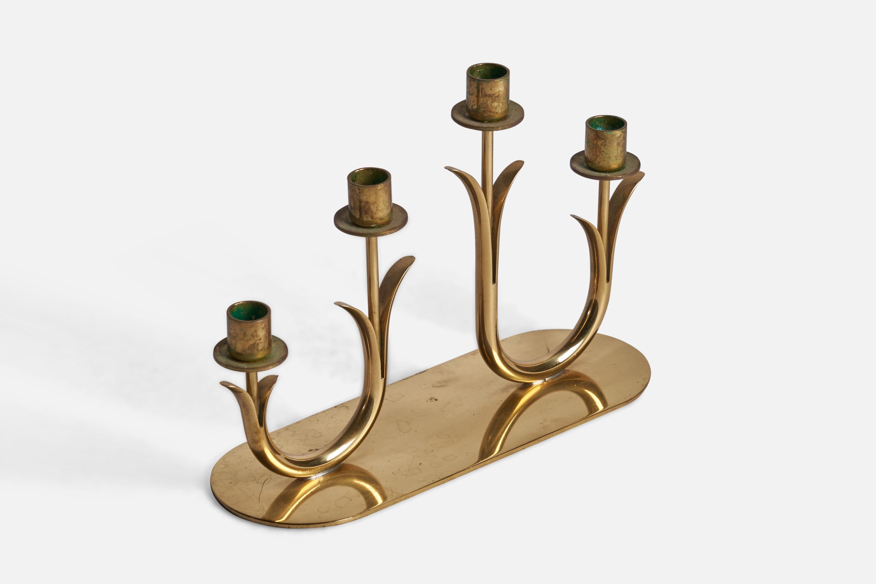 A brass candelabra designed by Gunnar Ander and produced by Ystad-Metall, Sweden, 1950s.

fits 0.45” diameter candles