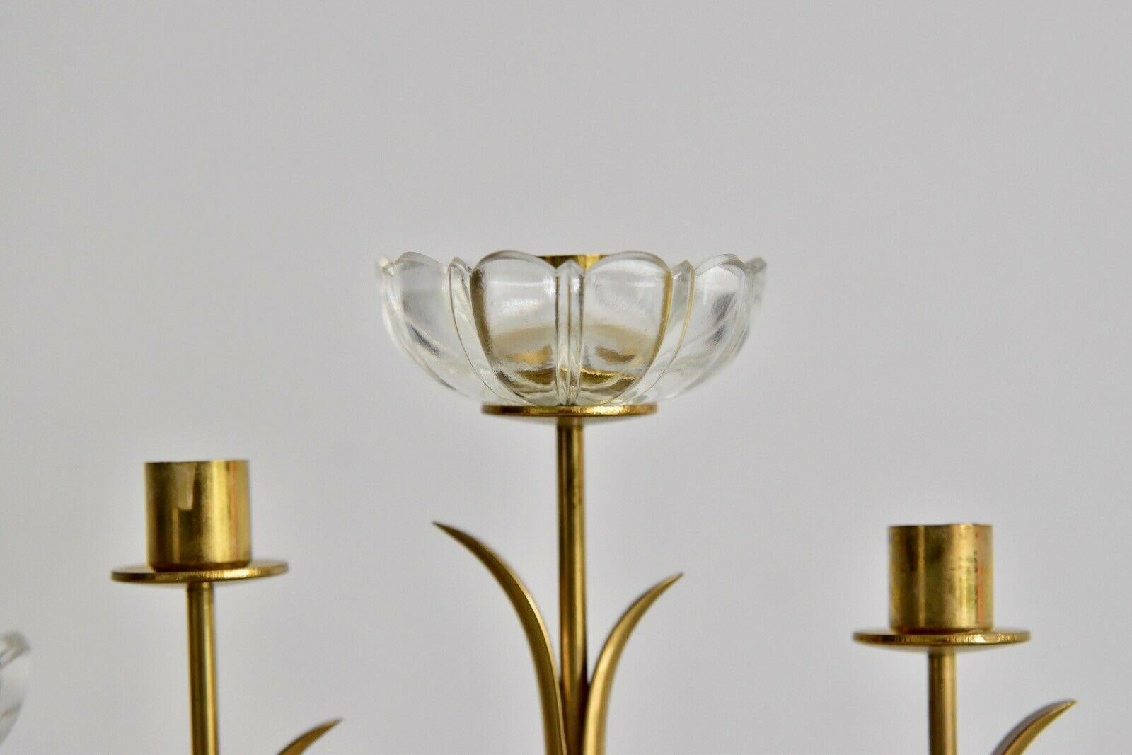 Gunnar Ander candlestick by Ystad Metal. Nice candleholder with transparent glass. The candleholder is marked on the bottom. The price is for one candleholder.