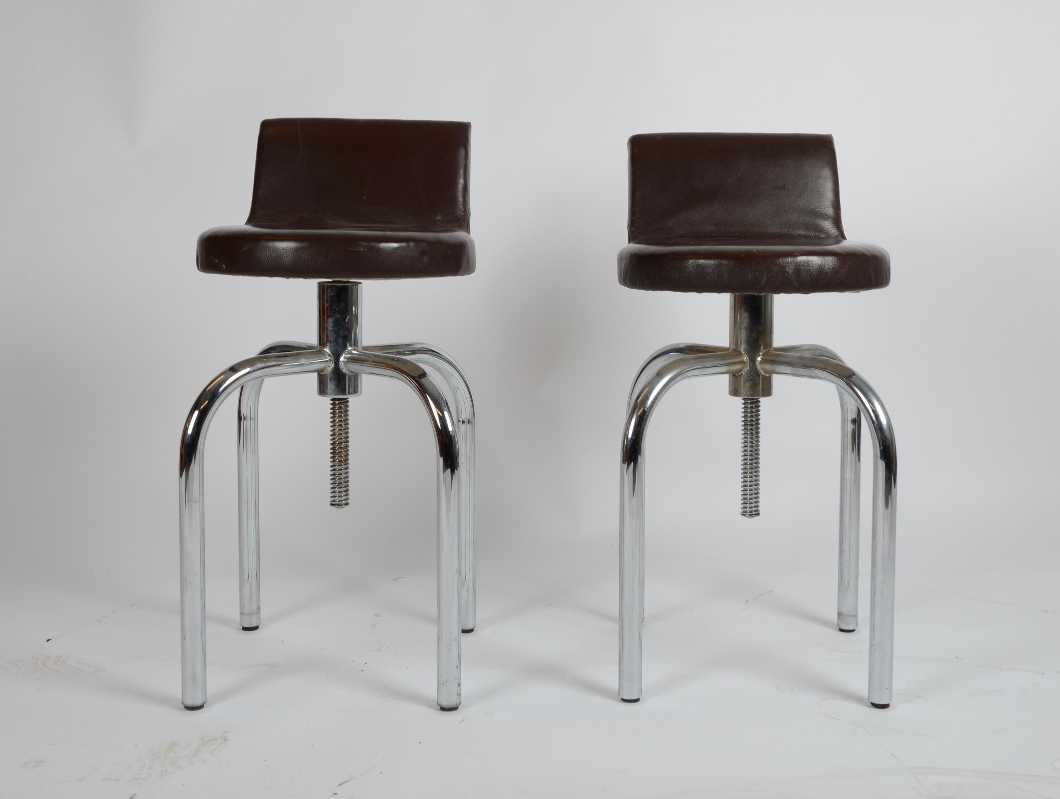 A pair of stools with low back, in leather, brass nails and steel. Designed by Gunnar Asplund. These are manufactured circa 1980s.

Measures: Height 61-77 cm, seat height 48-64 cm.