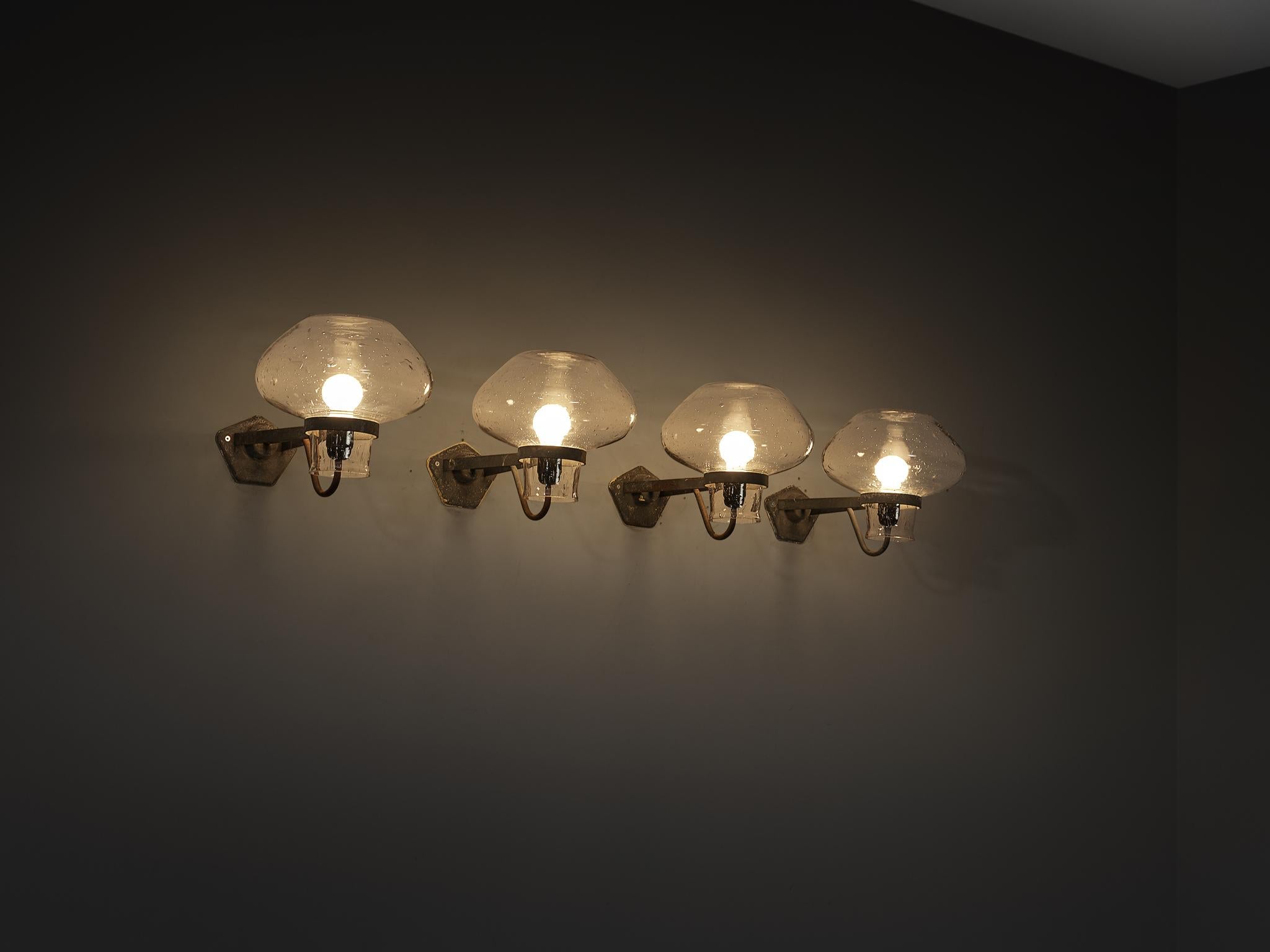 Gunnar Asplund for ASEA, wall lamps, model '641', blown glass, lacquered metal, Sweden, 1940s

Swedish architect Gunnar Asplund (1885–1940) designed this elegant wall lamp, model 641, in the 1940s. This striking fixture features a polygonal