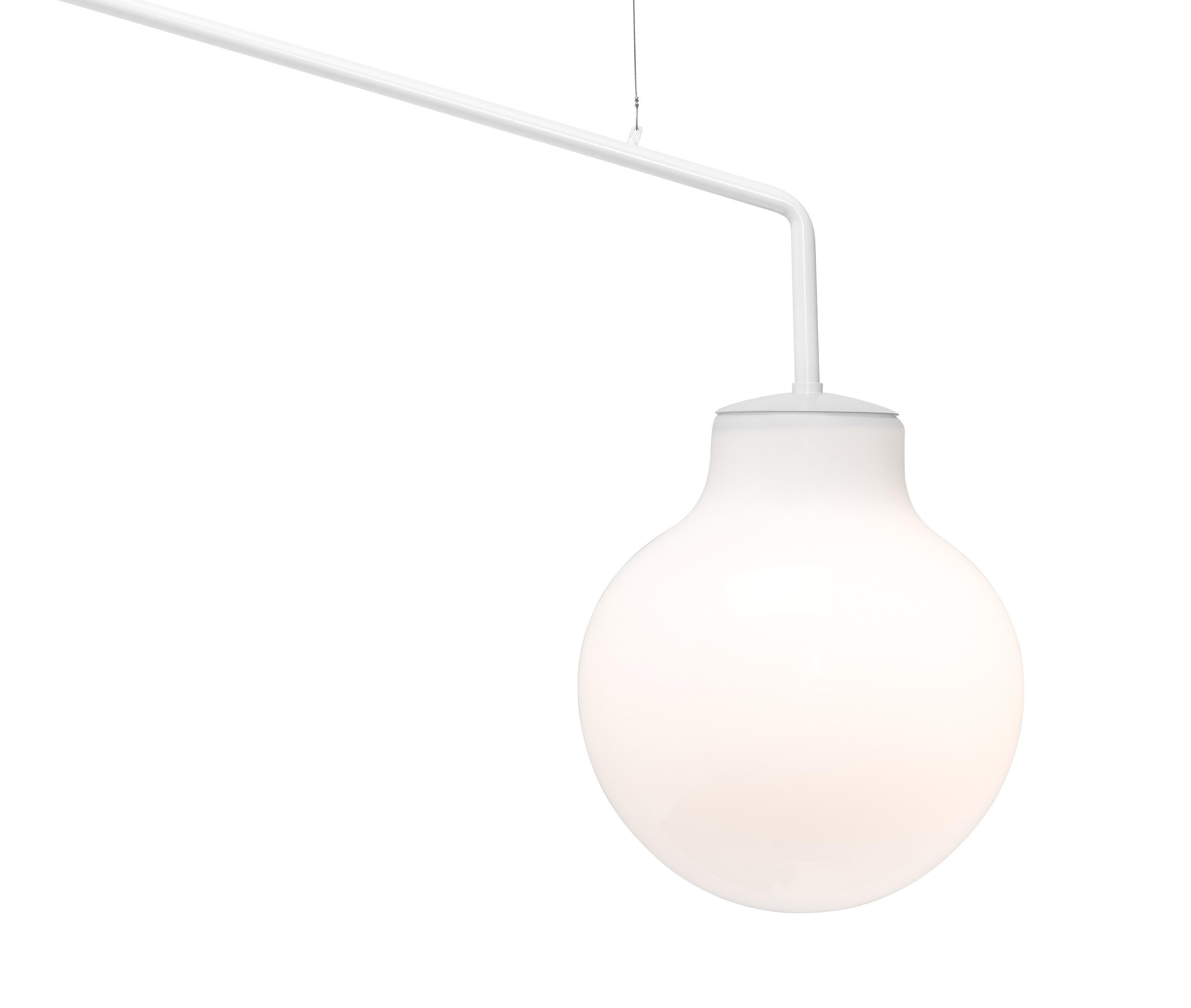 GA15 is a classical globe luminaire, save for the fact that it is a wall luminaire. The fitting consists of a mouthblown, three layered
opaque glass attached to a bent steelrod which grows out from the wall.

The quality of the glass in