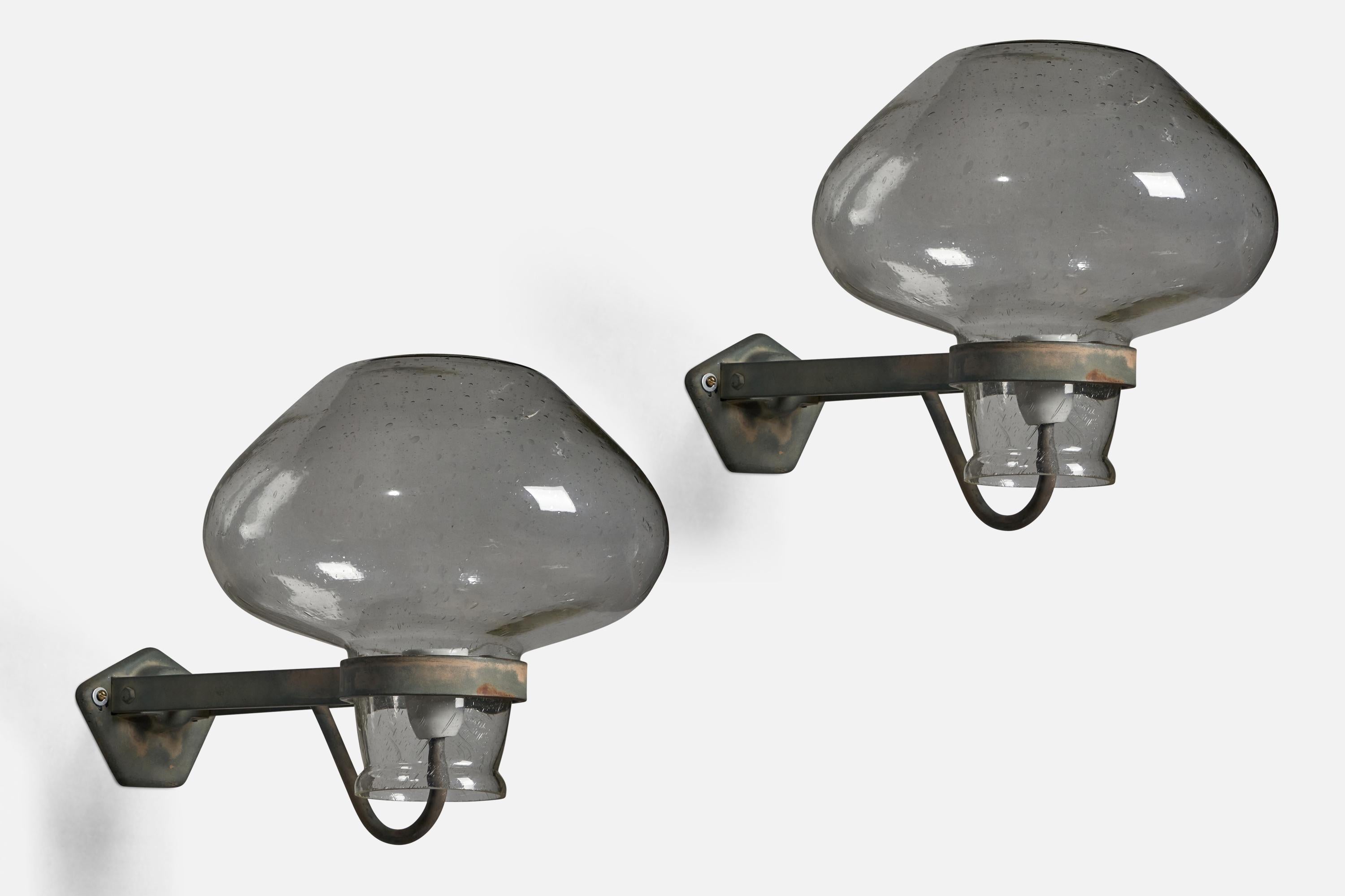 A pair of large black-painted iron and blown glass wall lights designed by Gunnar Asplund and produced by ASEA, Sweden, 1940s.

Overall Dimensions (inches): 15” H x 14” W x 21.5” D
Back Plate Dimensions (inches): 4.75” H x 6” W
Bulb Specifications: