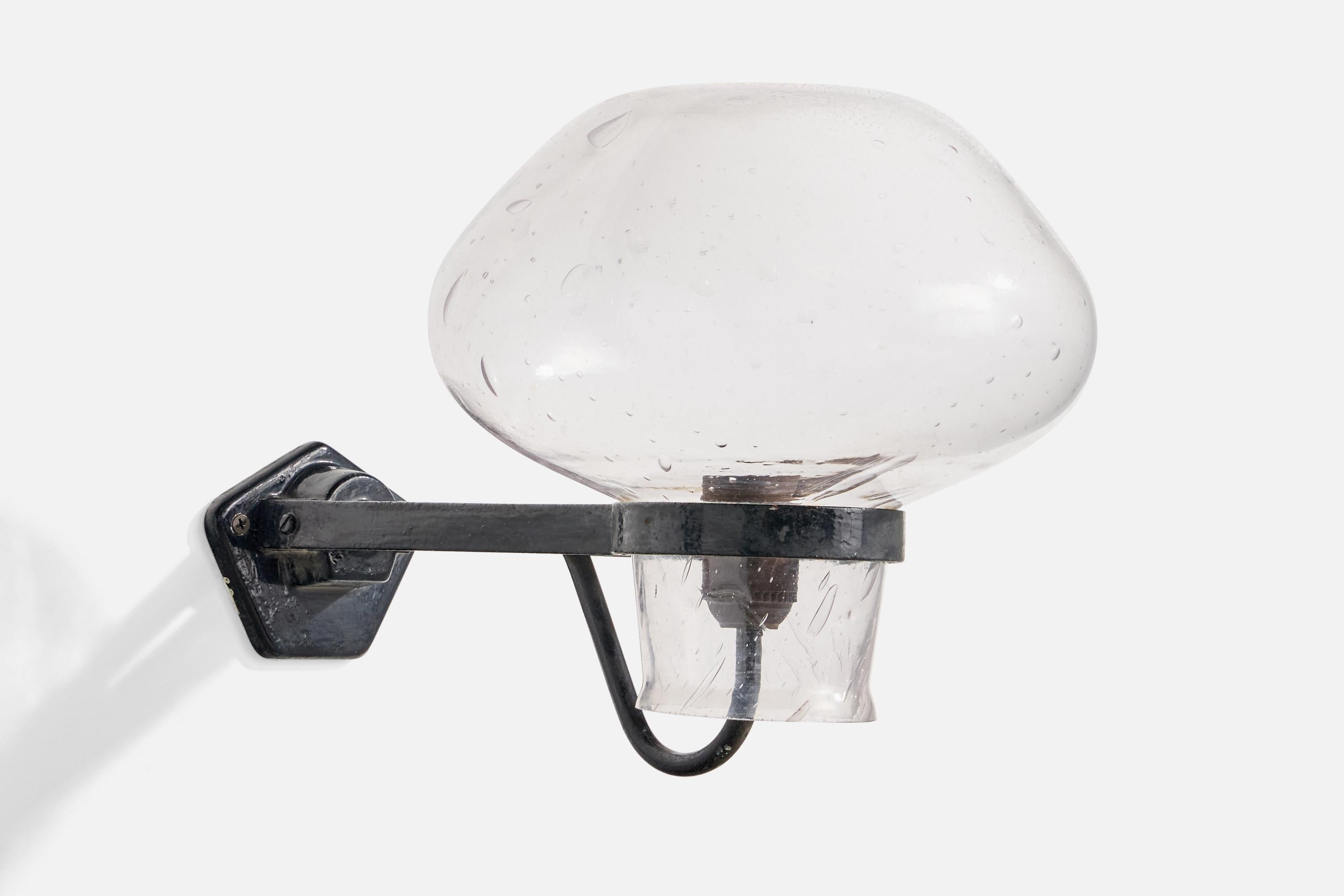 A black-painted iron and blown glass wall light designed by Gunnar Nylund and produced by ASEA, Sweden, 1940s.

Overall Dimensions (Inches): 10.5” H x 10.5” W x 15.5” D

Back Plate Dimensions (Inches): 3.55” H x 4.5“ W x 1.4” D

Bulb Specifications: