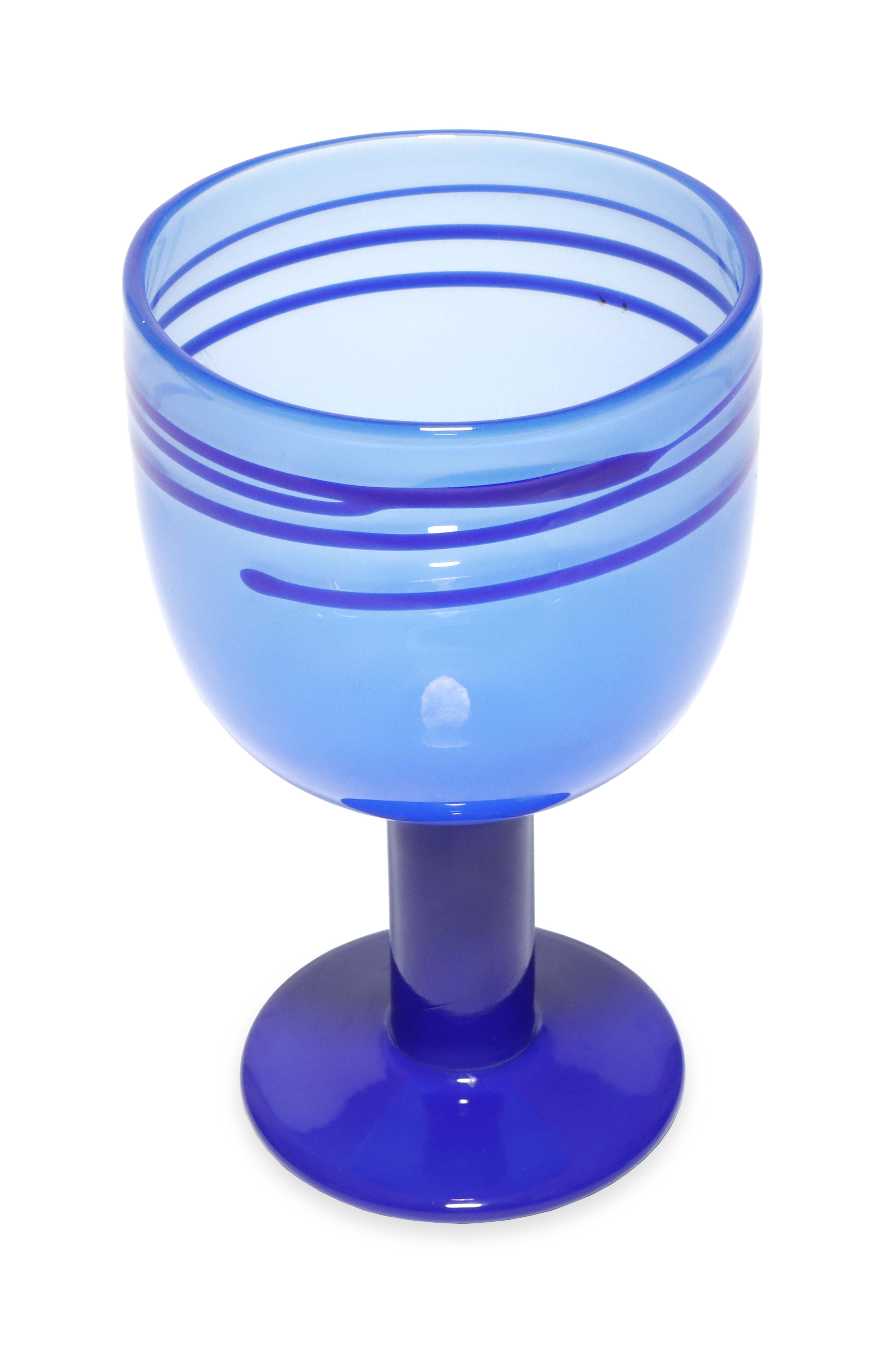 Blue glass 'Pop' goblets by Swedish designer Gunnar Cyren, produced by Orrefors, c. 1968. This goblet has a darker blue handle and vase and a beutiful detail around the top rim. Engraved signature on bottom 