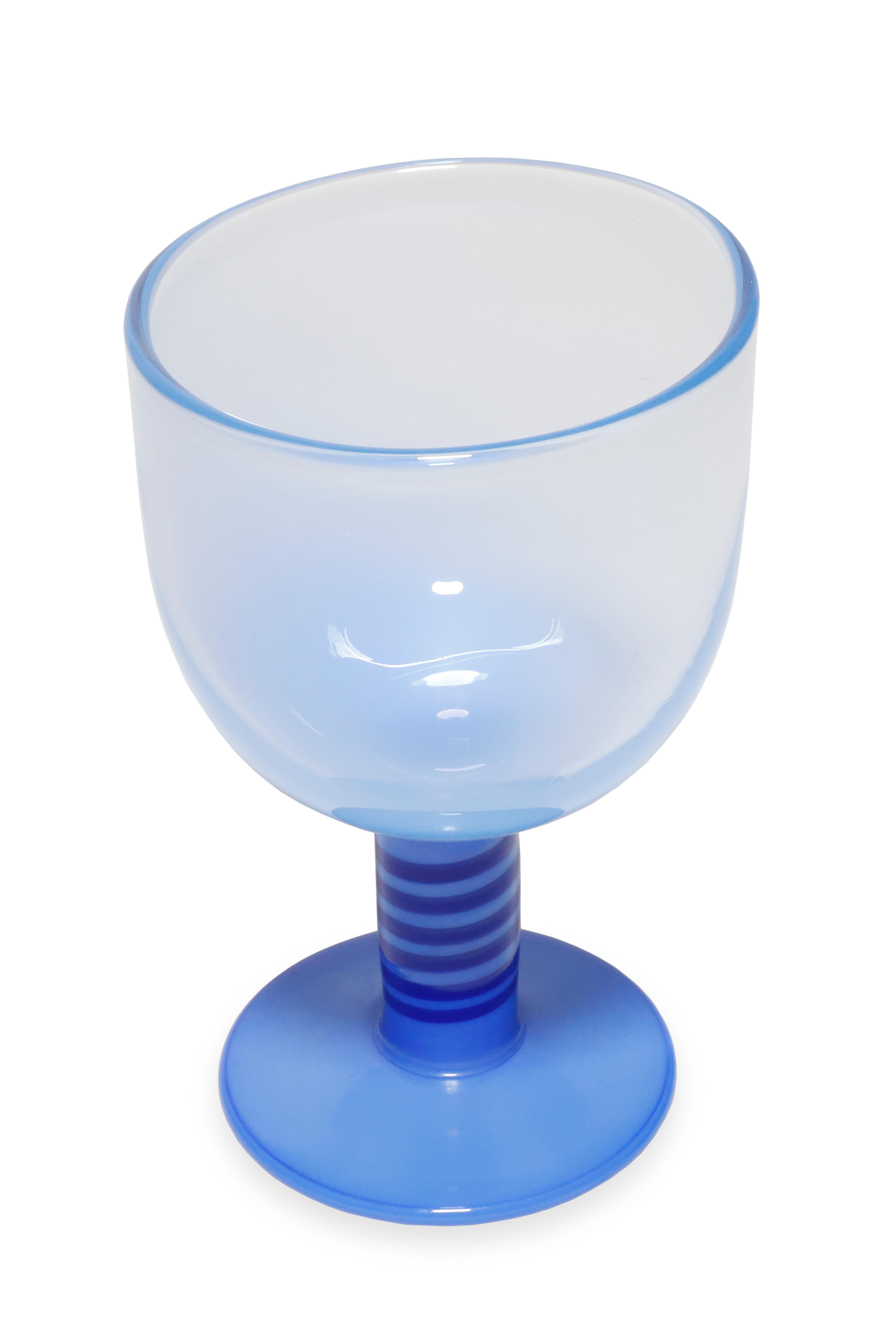 Light blue glass 'Pop' goblets by Swedish designer Gunnar Cyren, produced by Orrefors, c. 1968. This goblet has a darker blue detal on handle. Engraved signature on bottom 