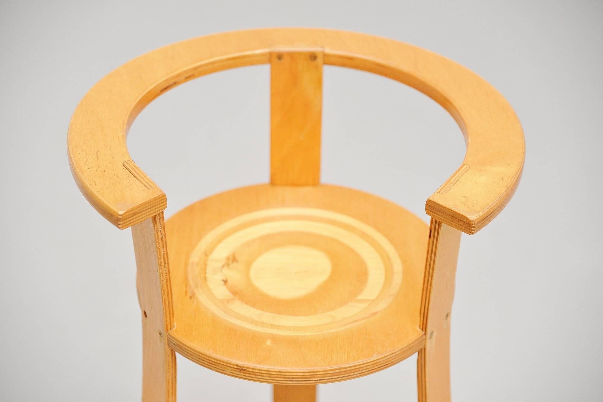 Nice and rare high kids chair designed by Gunnar Daan for his own children in 1966 when Metz & Co took it in production afterwards. The chair is made of birch plywood and due to several sized circles the chair could be made out of one sheet of