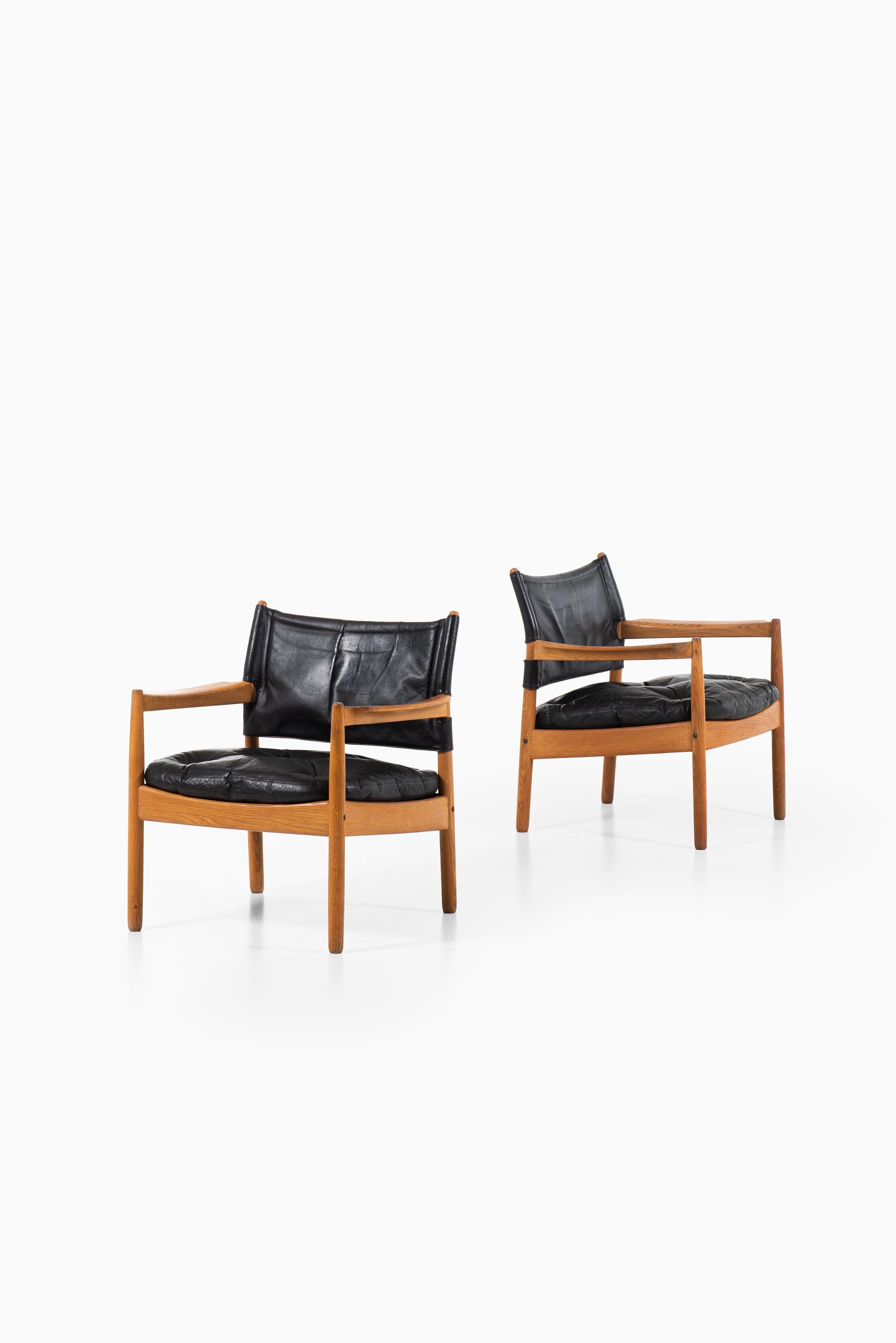 A pair of easy chairs designed by Gunnar Myrstrand. Produced by Källemo in Sweden.