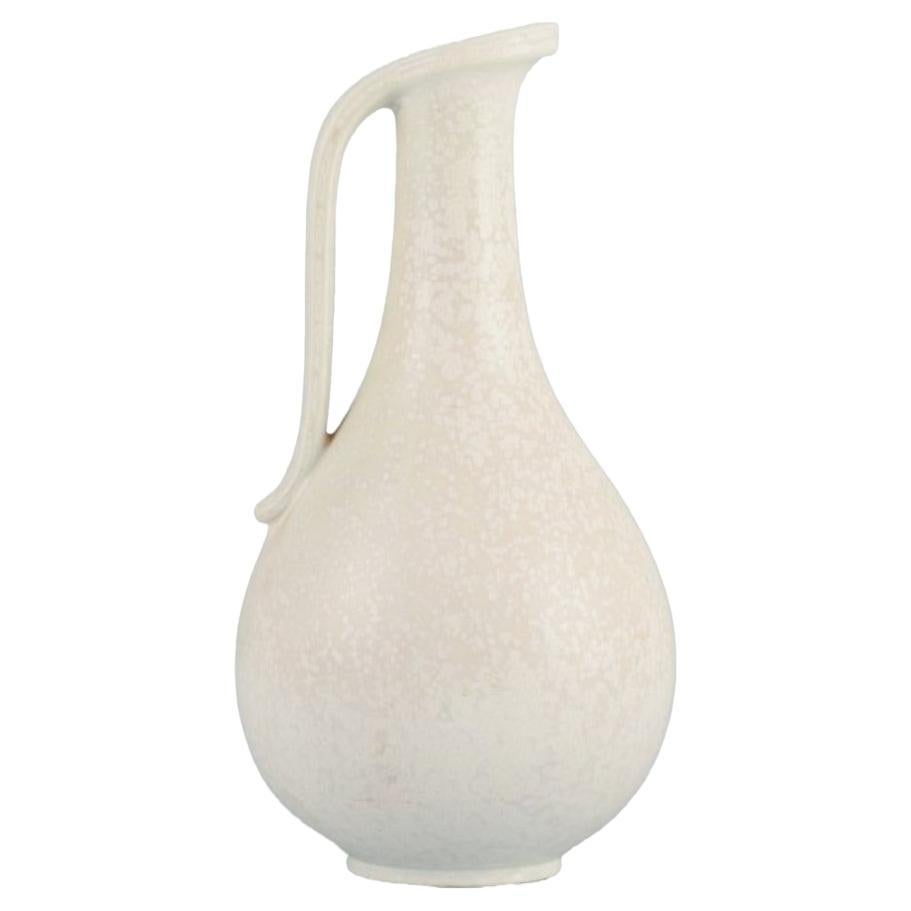 Gunnar Nylund (1904–1997) for Rörstrand. Large jug in eggshell glaze. Mid-20th c