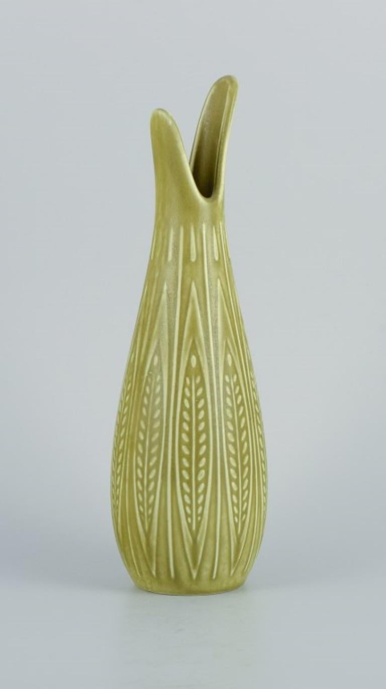 Gunnar Nylund (1904–1997) for Rörstrand. 
Rialto vase in ceramic, organic shape with light green glaze.
1960s.
In perfect condition.
Marked.
Dimensions: H 23.5 x D 7.0 cm.

