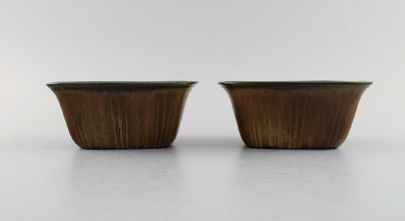Gunnar Nylund (1904-1997) for Rörstrand. Two bowls in glazed ceramics. 
Beautiful glaze in brown shades. Mid-20th century.
Measures: 14 x 6.5 cm.
In excellent condition.
Signed.
2nd factory quality.