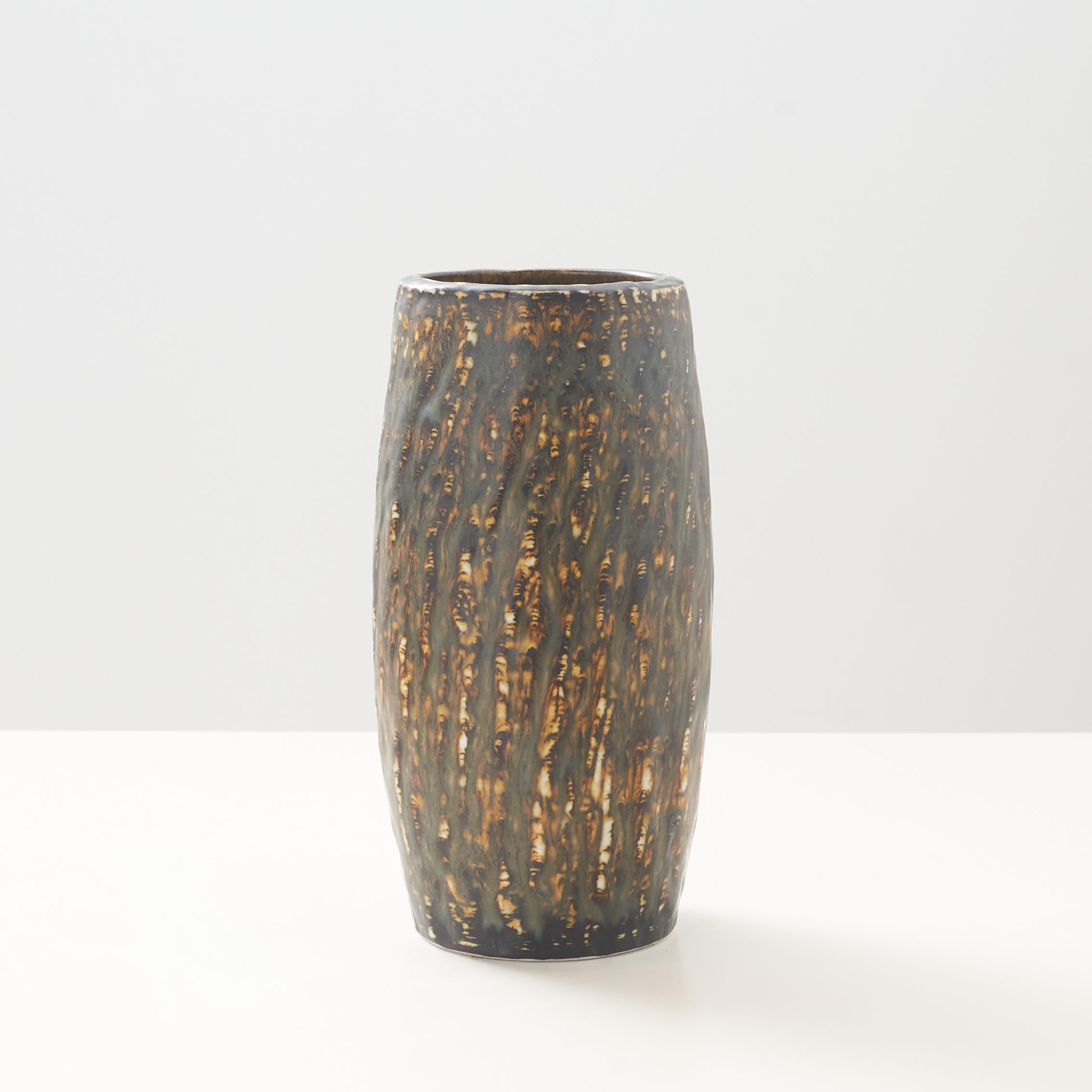A model 12 vase from the Rebus series glazed in brown, yellow and gray tones by Gunnar Nylund for Rörstrand. Inscribed on the base with the makers and the manufacturer's mark.

Very good vintage condition. No chips or scratches.