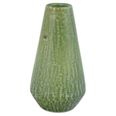 Gunnar Nylund for Nymølle, Denmark. Stoneware vase with green flowing glaze.
