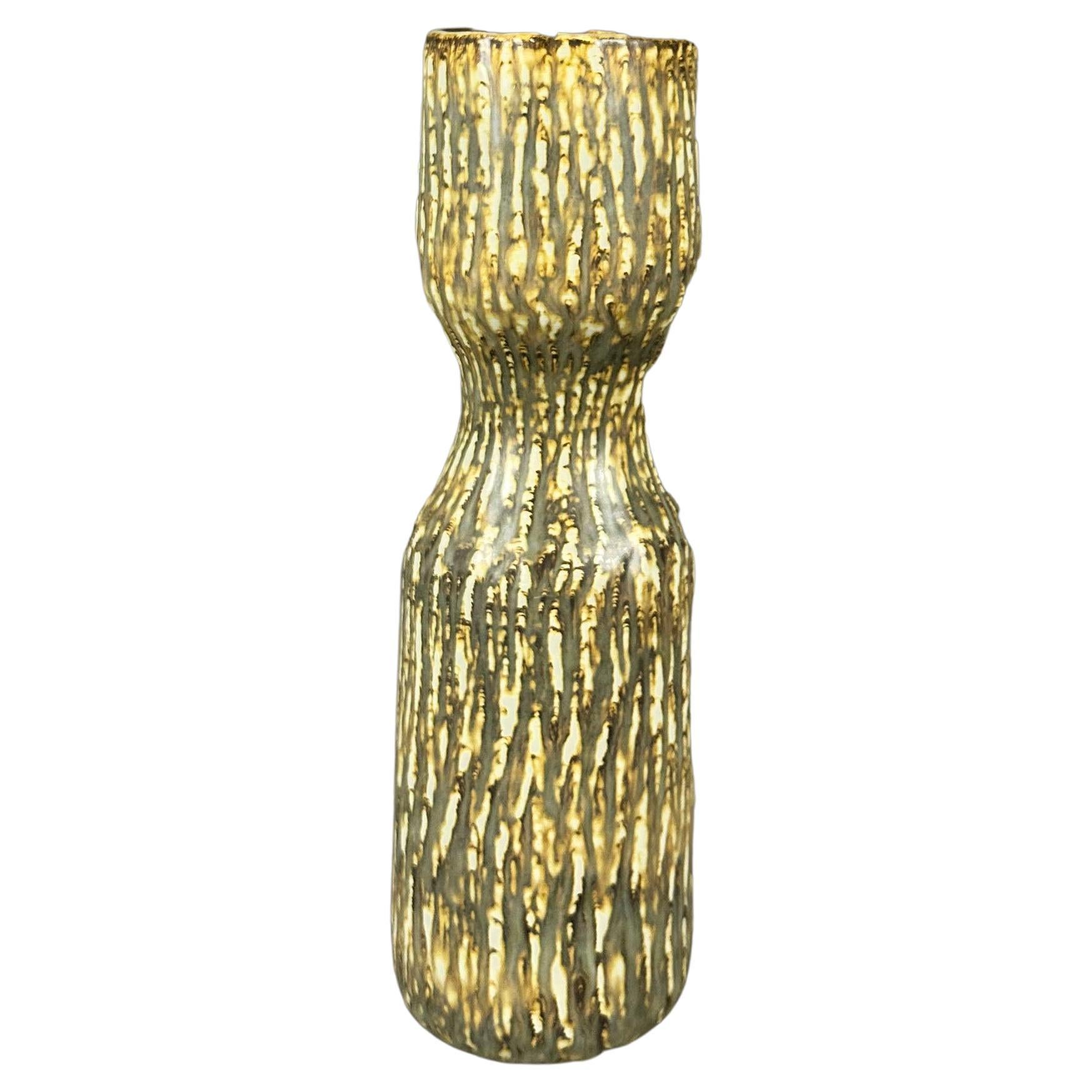 Designed by Gunnar Nylund in 1965 for the Rubus Collection this cylindric, ocre and green glazed vase is a beautiful piece of Swedish ceramic design. Signed with Rörstrand 