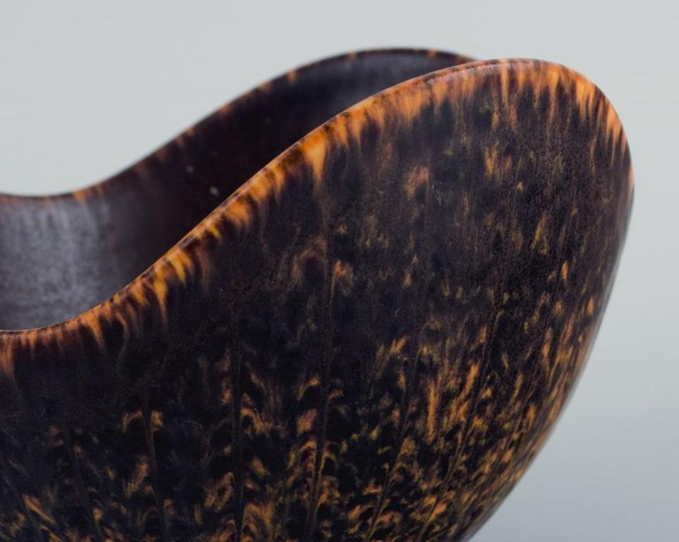 Glazed Gunnar Nylund for Rörstrand. Ceramic bowl with dark brown and orange glaze For Sale