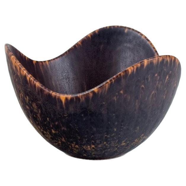 Gunnar Nylund for Rörstrand. Ceramic bowl with dark brown and orange glaze For Sale